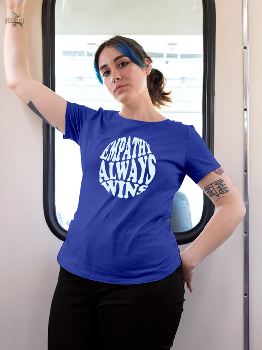Fighterhero T-shirts: Model wearing Women's Blue Round Neck T-shirt with 'Empathy Always Wins' design