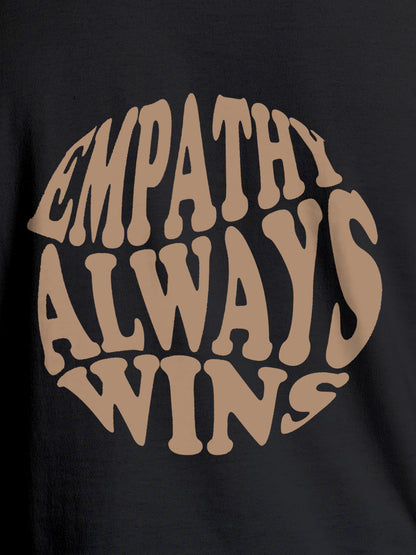 Close up of 'Empathy Always Wins' design on Men's Dark Grey Round Neck T-shirt, highlighting intricate details and vibrant print.
