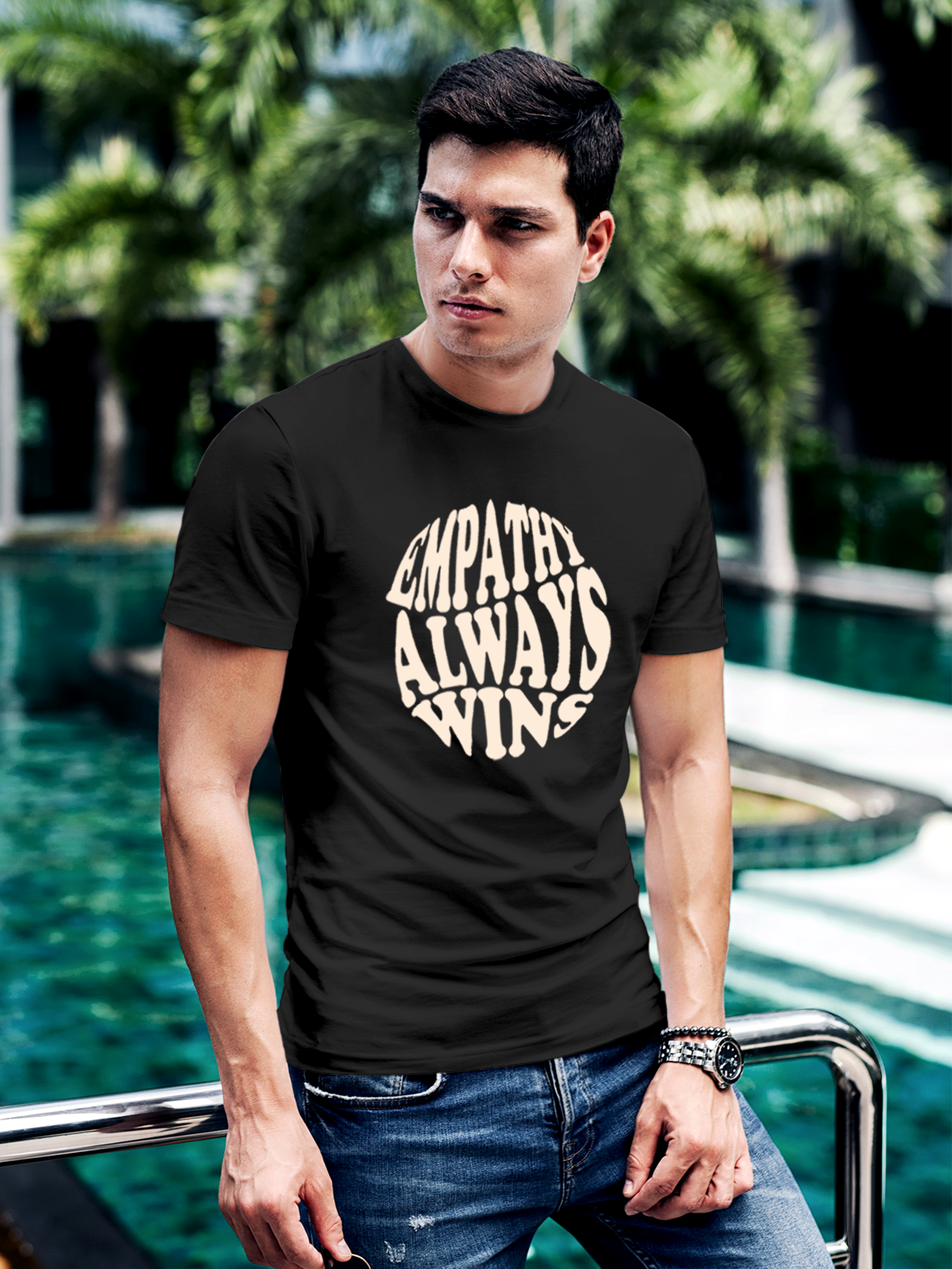 Model wearing Men's Dark Grey Round Neck T-shirt with 'Empathy Always Wins' design, offering effortless style and premium comfort