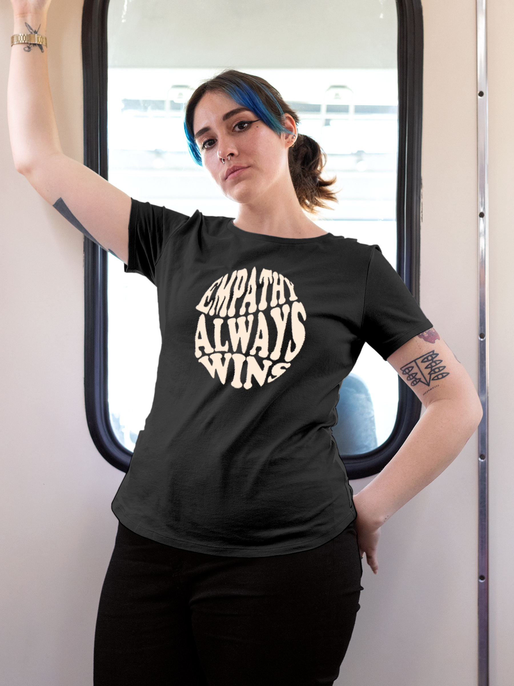 Model wearing Women's Dark Grey Round Neck T-shirt with 'Empathy Always Wins' design, offering effortless style and premium comfort