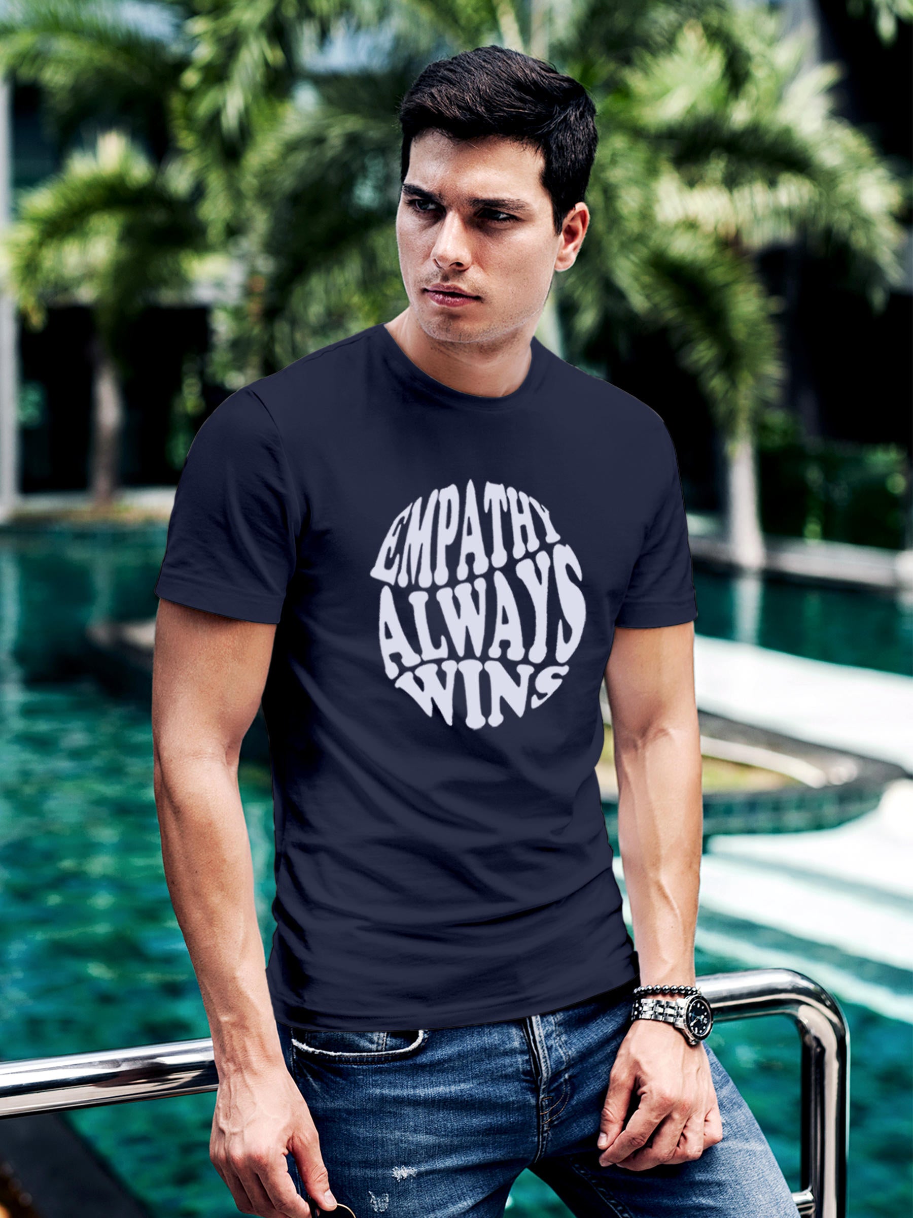 Model wearing Men's Navy Blue Round Neck T-shirt with 'Empathy Always Wins' design, offering effortless style and premium comfort