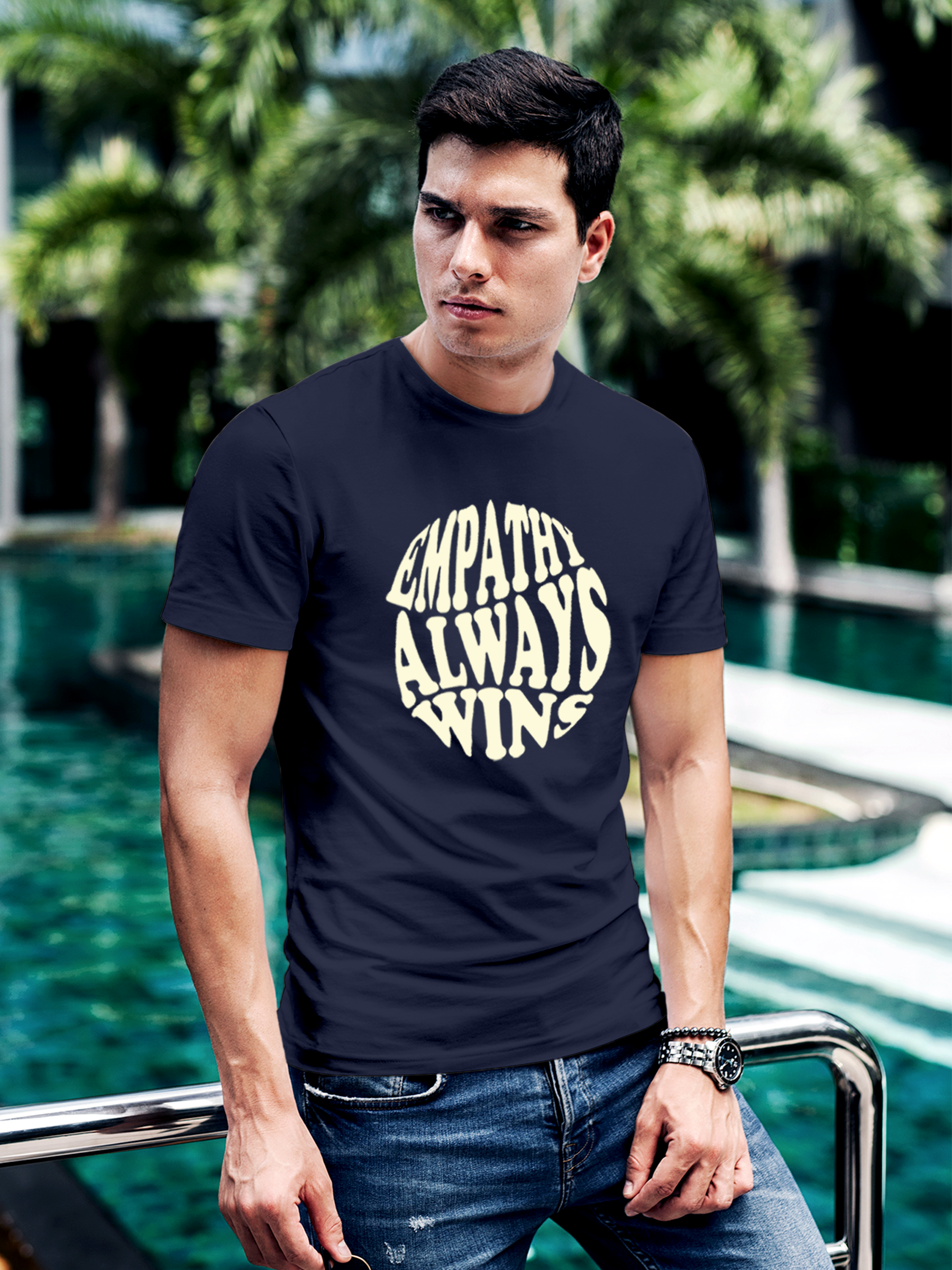 Model wearing Men's Navy Blue Round Neck T-shirt with 'Empathy Always Wins' design, offering effortless style and premium comfort
