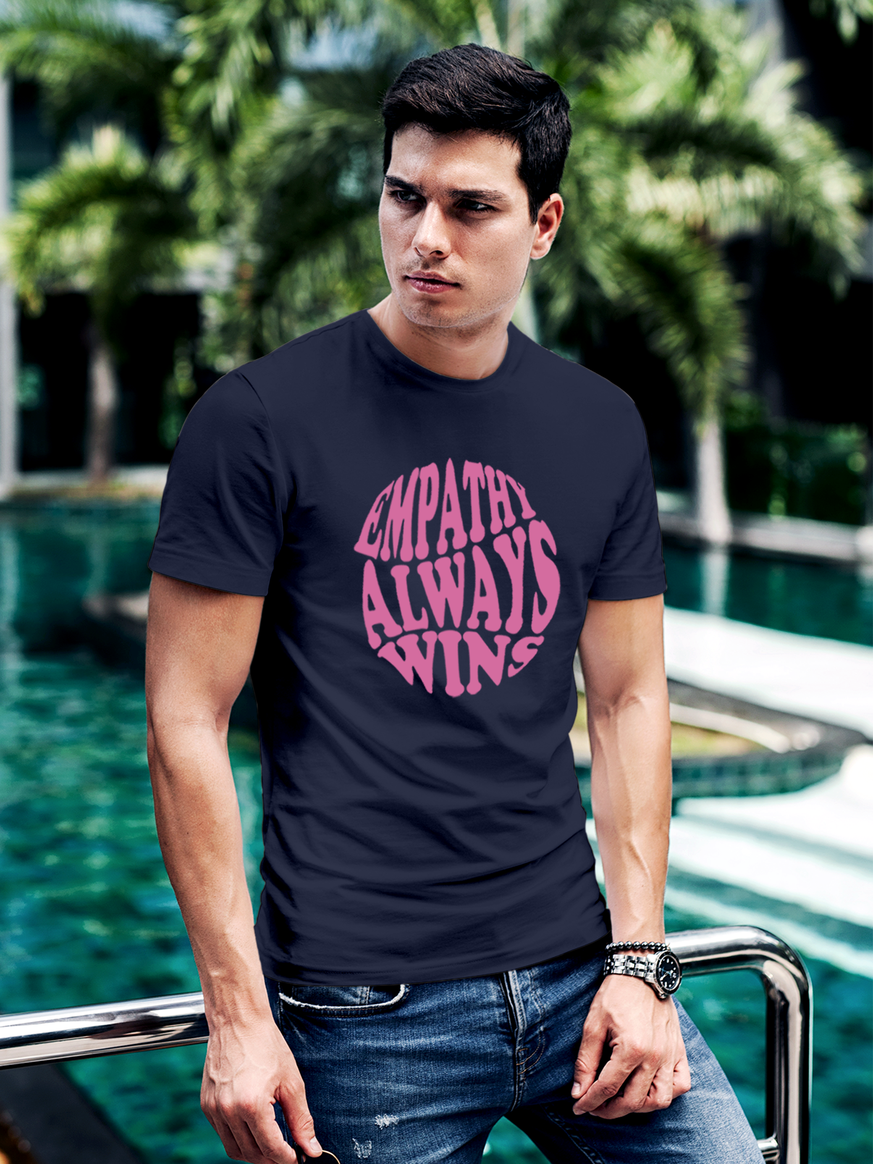 Model wearing Men's Navy Blue Round Neck T-shirt with 'Empathy Always Wins' design, offering effortless style and premium comfort