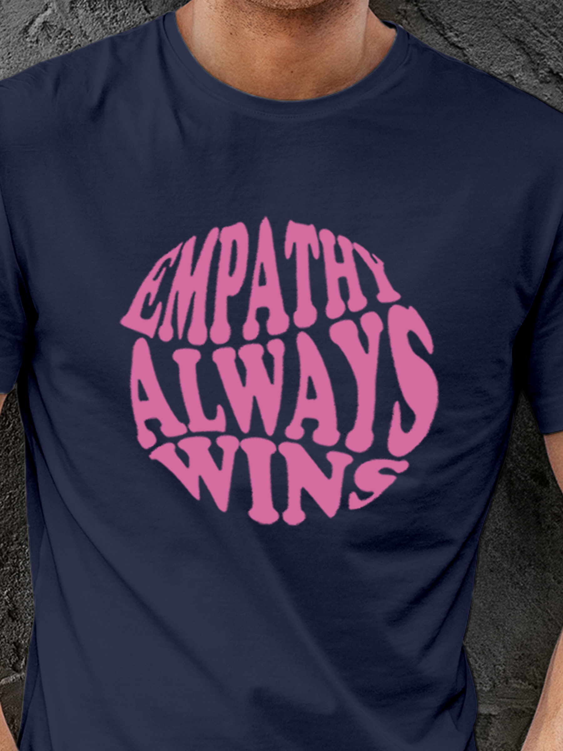 Close up of 'Empathy Always Wins' design on Men's Navy Blue Round Neck T-shirt, highlighting intricate details and vibrant print.