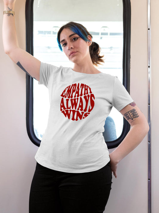 Model wearing Women's White Round Neck T-shirt with 'Empathy Always Wins' design, offering effortless style and premium comfort