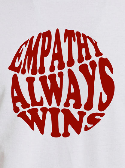 Close up of 'Empathy Always Wins' design on Women's White Round Neck T-shirt, highlighting intricate details and vibrant print.