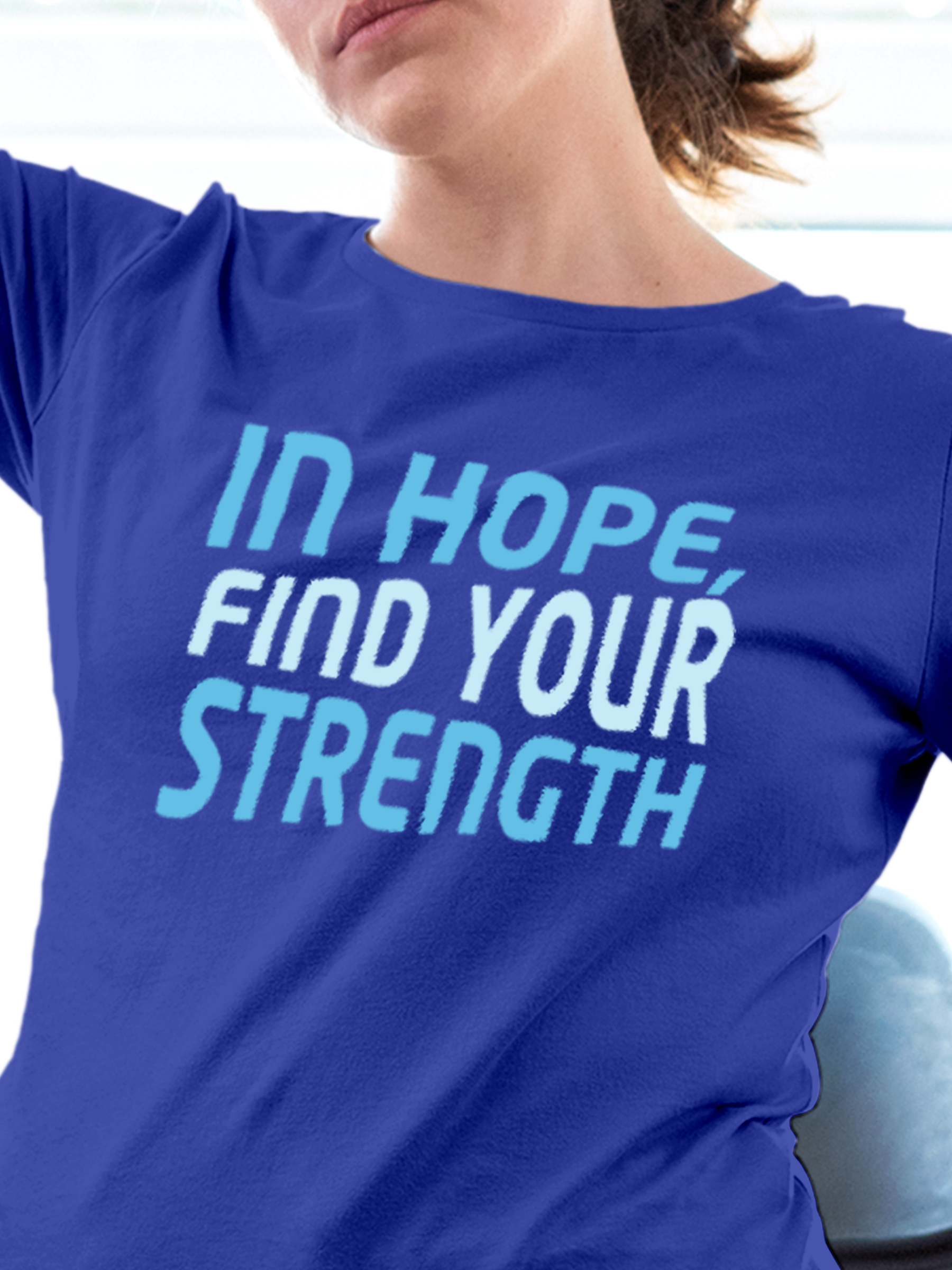 Close up of 'In Hope, Find Your Strength' design on Women's Blue Round Neck T-shirt, highlighting intricate details and vibrant print.