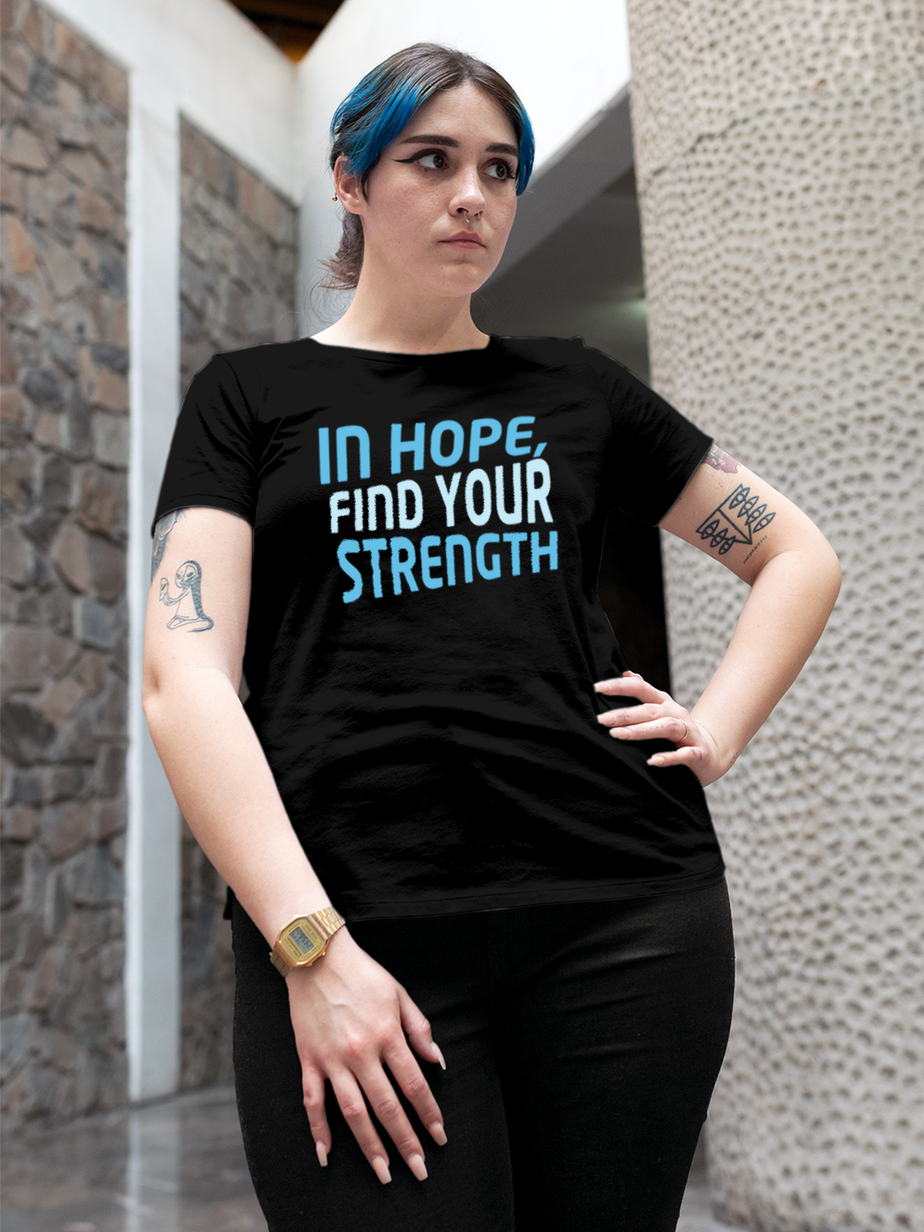 Model wearing Women's Black Round Neck T-shirt with 'In Hope, Find Your Strength' design, offering effortless style and premium comfort