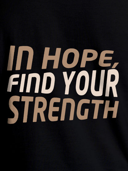Close up of 'In Hope, Find Your Strength' design on Women's Black Round Neck T-shirt, highlighting intricate details and vibrant print.