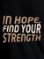 Close up of 'In Hope, Find Your Strength' design on Women's Black Round Neck T-shirt, highlighting intricate details and vibrant print.