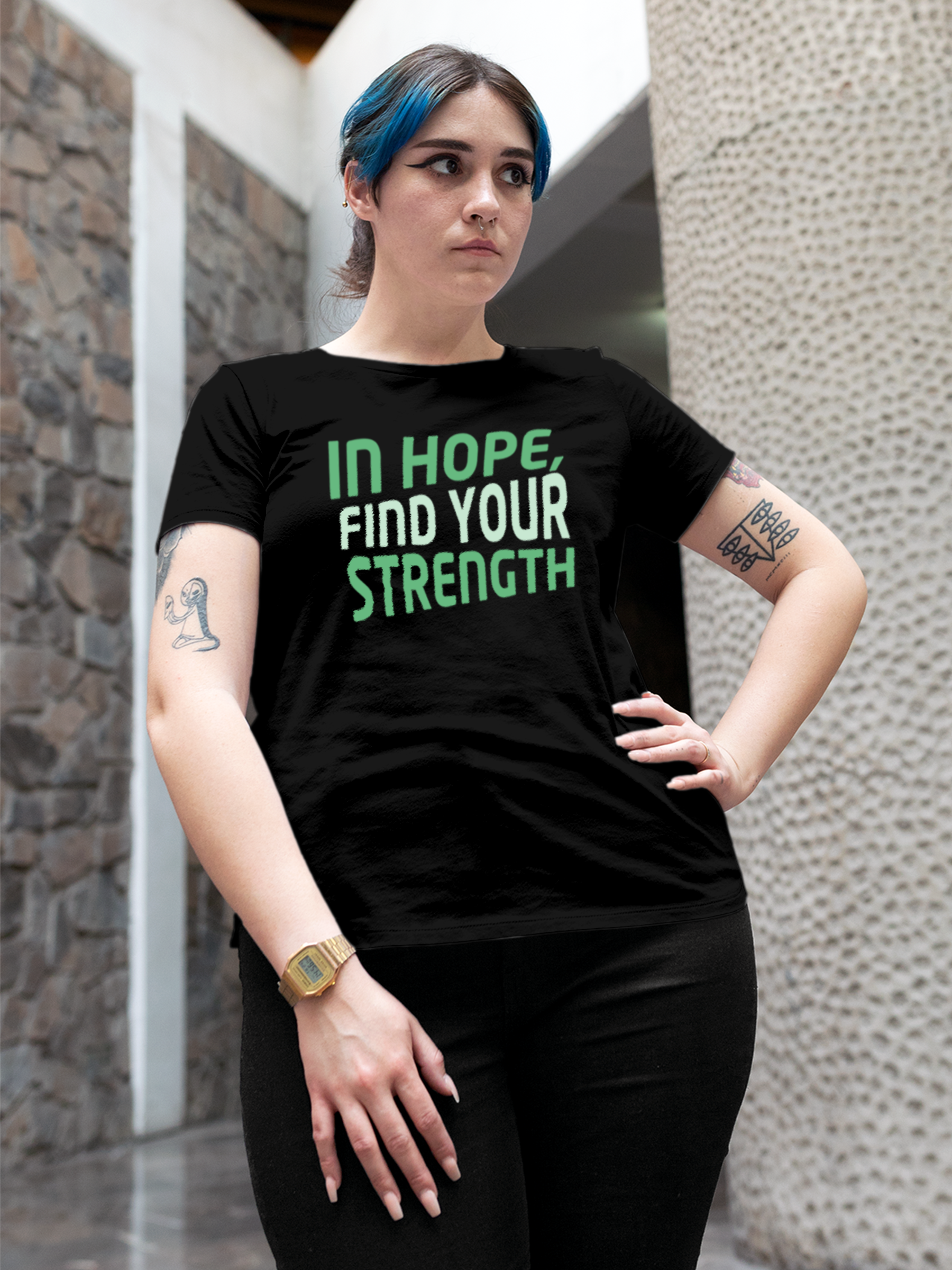 Model wearing Women's Black Round Neck T-shirt with 'In Hope, Find Your Strength' design, offering effortless style and premium comfort