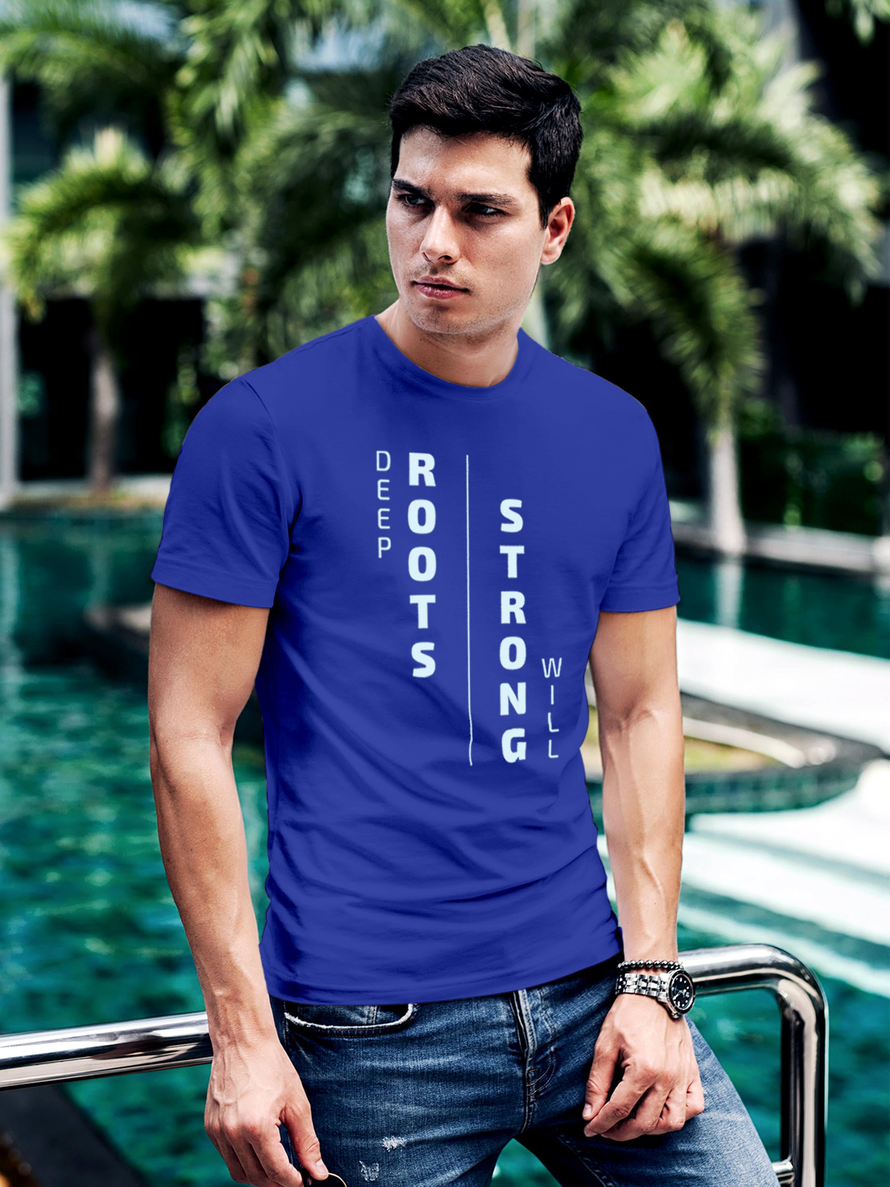 Model wearing Men's Blue Round Neck T-shirt with 'Deep Roots Strong Will' design, offering effortless style and premium comfort