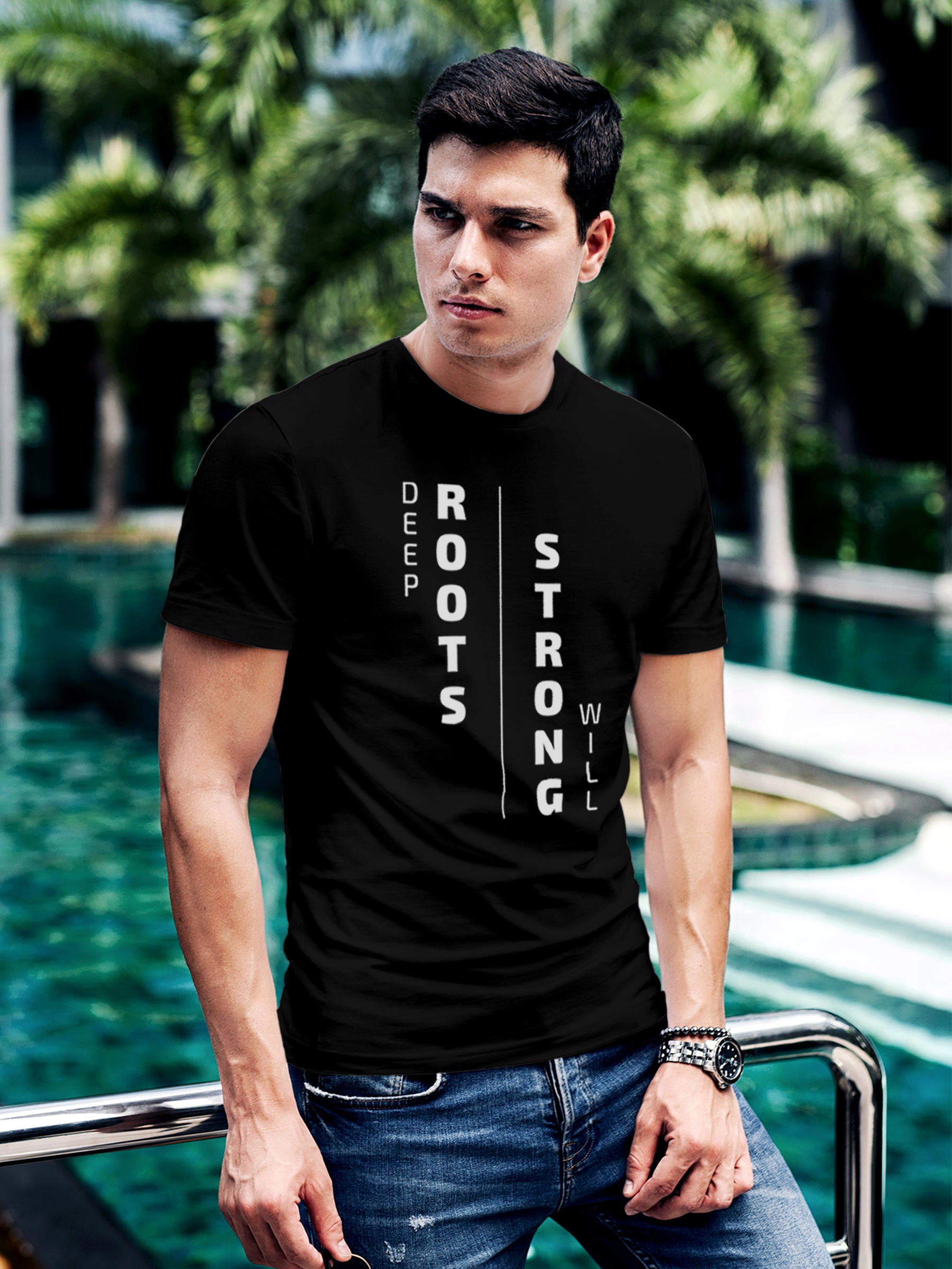 Model wearing Men's Black Round Neck T-shirt with 'Deep Roots Strong Will' design, offering effortless style and premium comfort