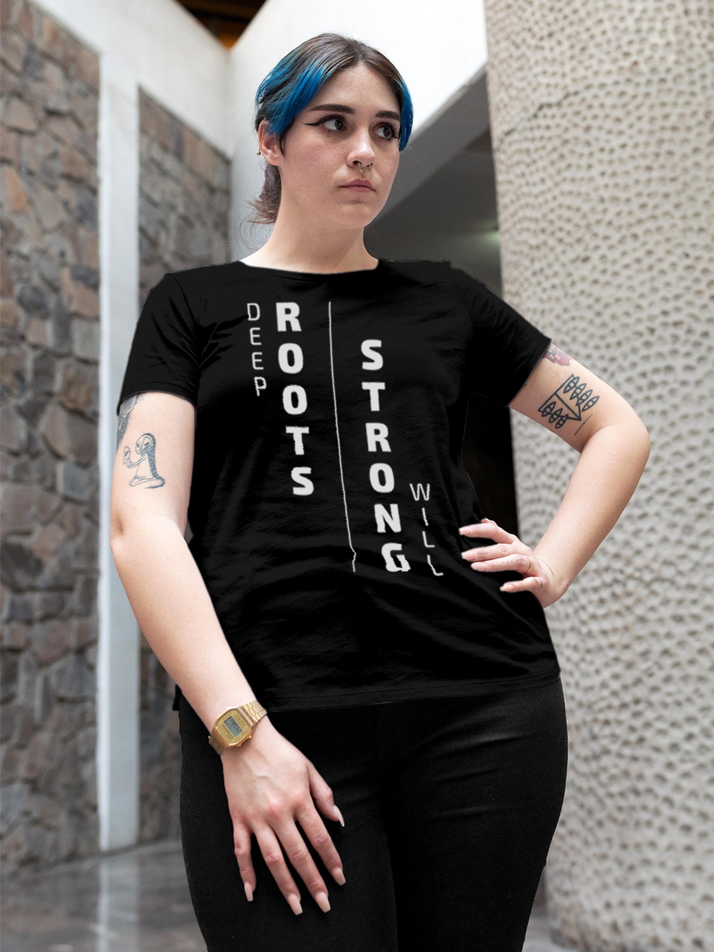 Model wearing Women's Black Round Neck T-shirt with 'Deep Roots Strong Will' design, offering effortless style and premium comfort