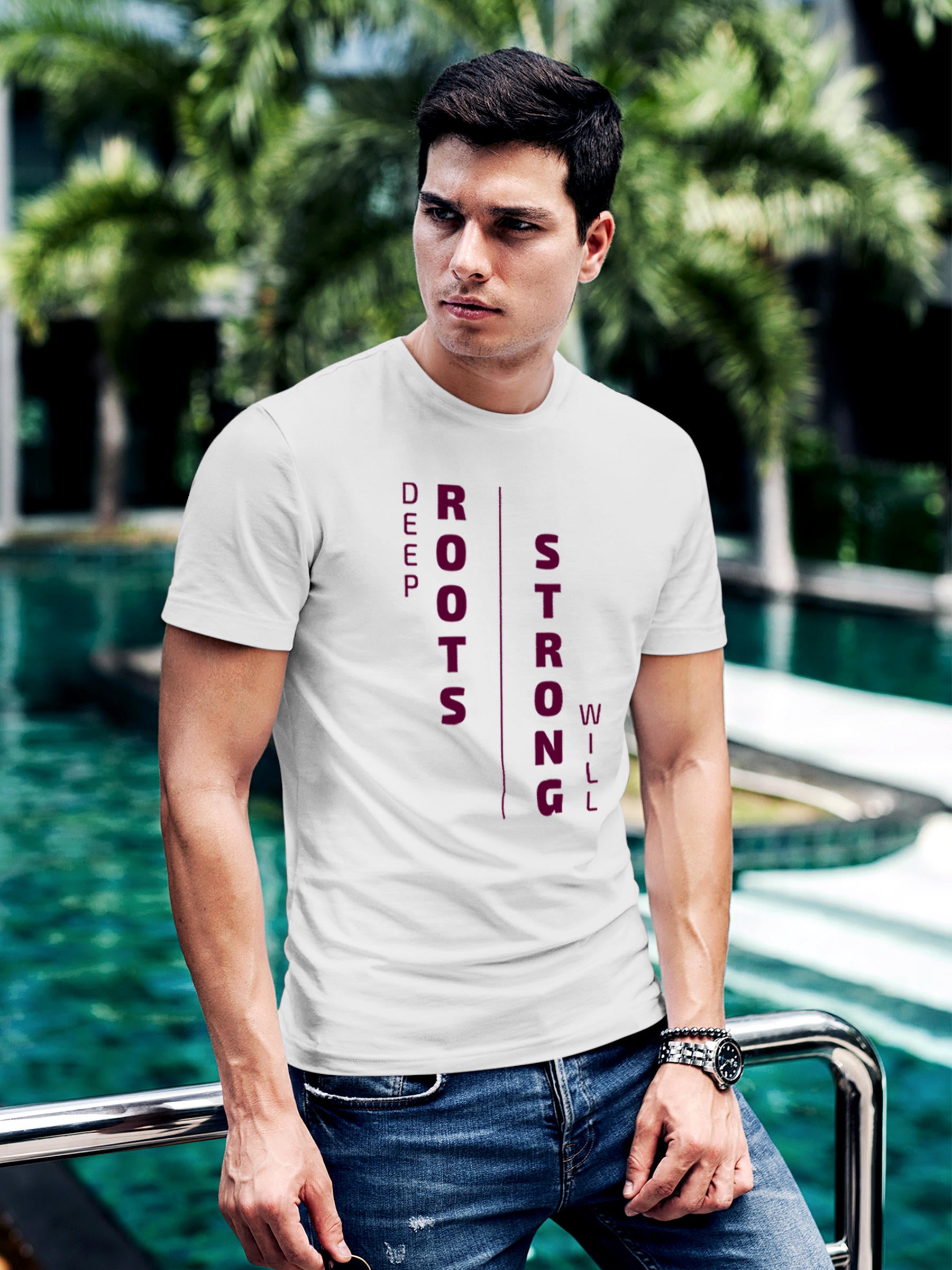 Model wearing Men's White Round Neck T-shirt with 'Deep Roots Strong Will' design, offering effortless style and premium comfort