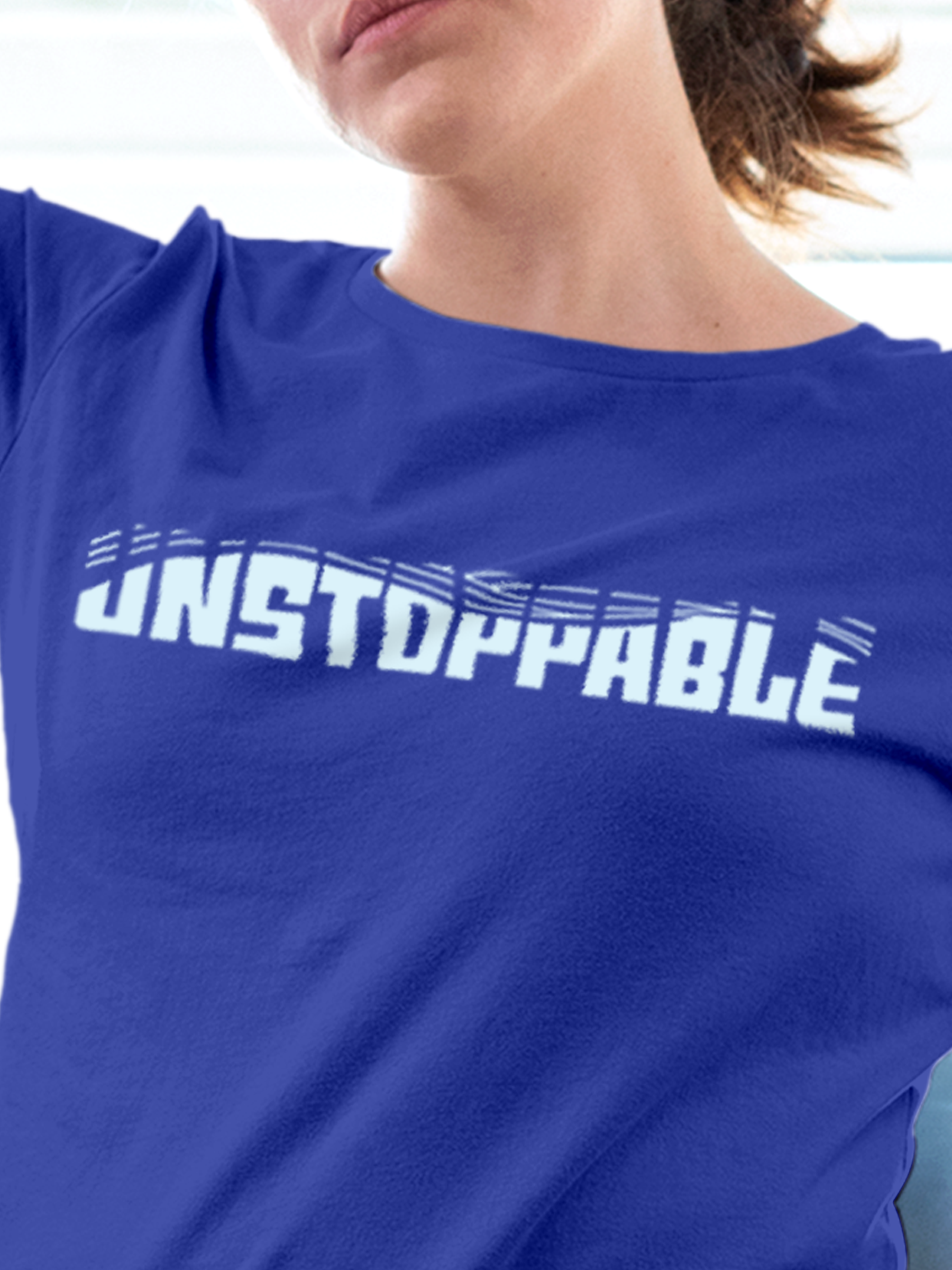 Close up of 'Unstoppable' design on Women's Blue Round Neck T-shirt, highlighting intricate details and vibrant print.