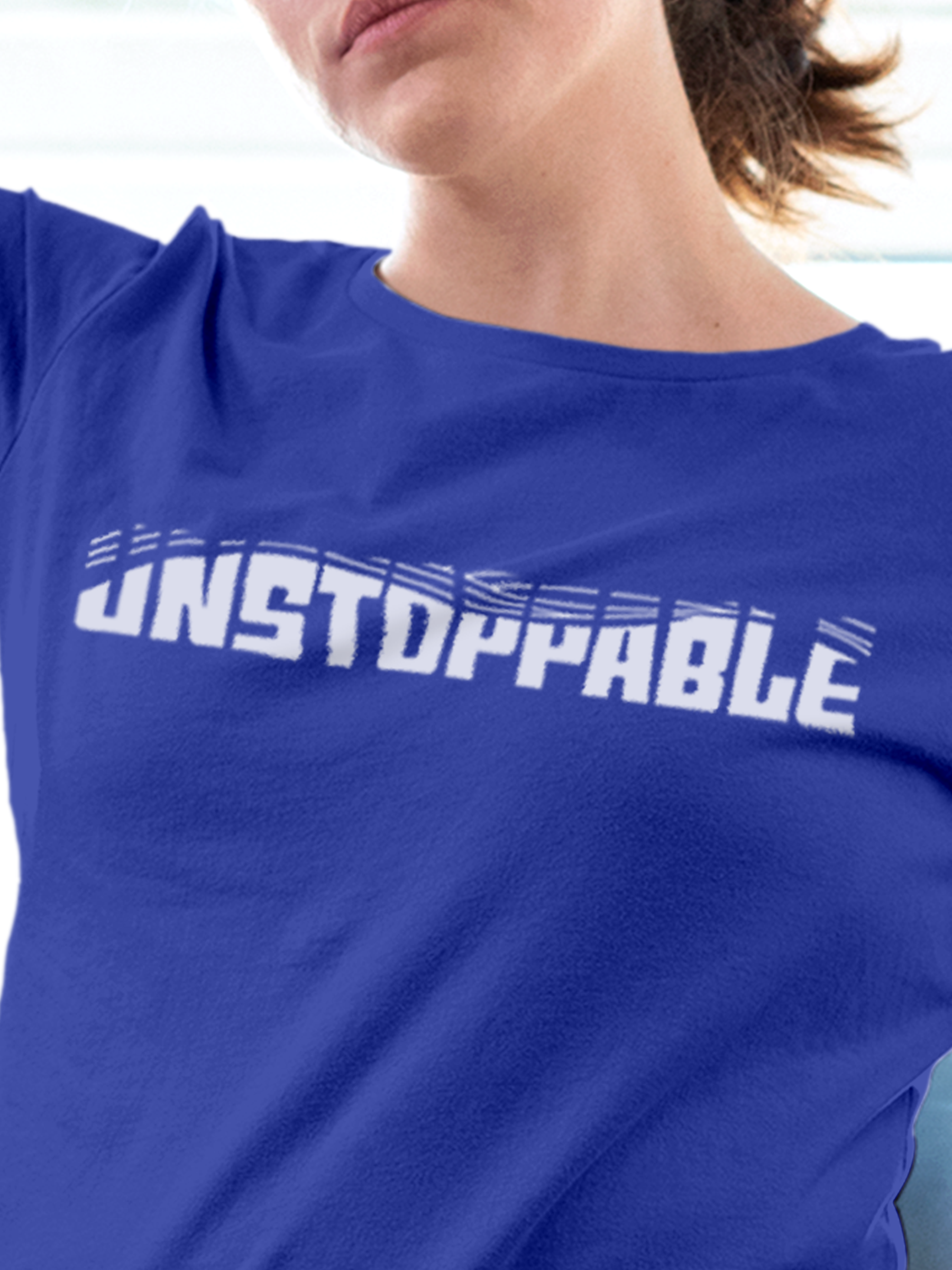Close up of 'Unstoppable' design on Women's Blue Round Neck T-shirt, highlighting intricate details and vibrant print.