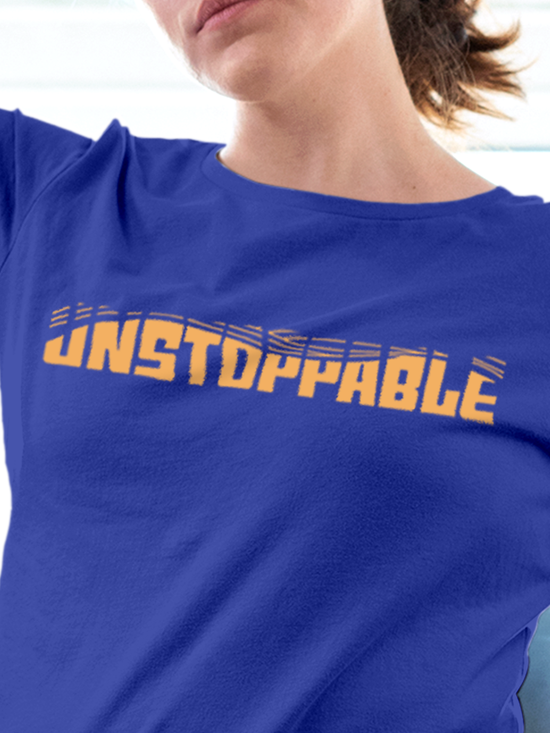 Close up of 'Unstoppable' design on Women's Blue Round Neck T-shirt, highlighting intricate details and vibrant print.