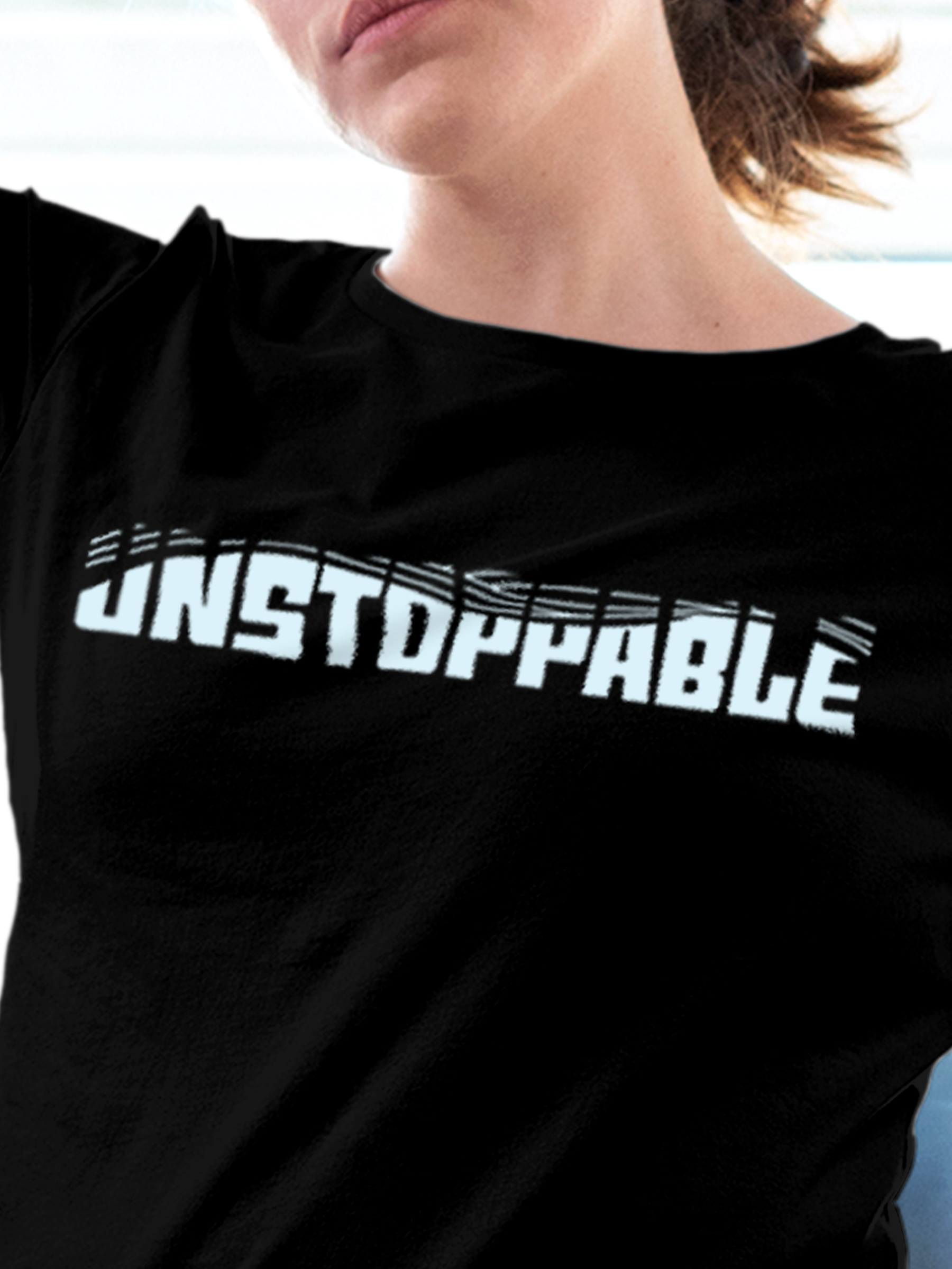 Close up of 'Unstoppable' design on Women's Black Round Neck T-shirt, highlighting intricate details and vibrant print.