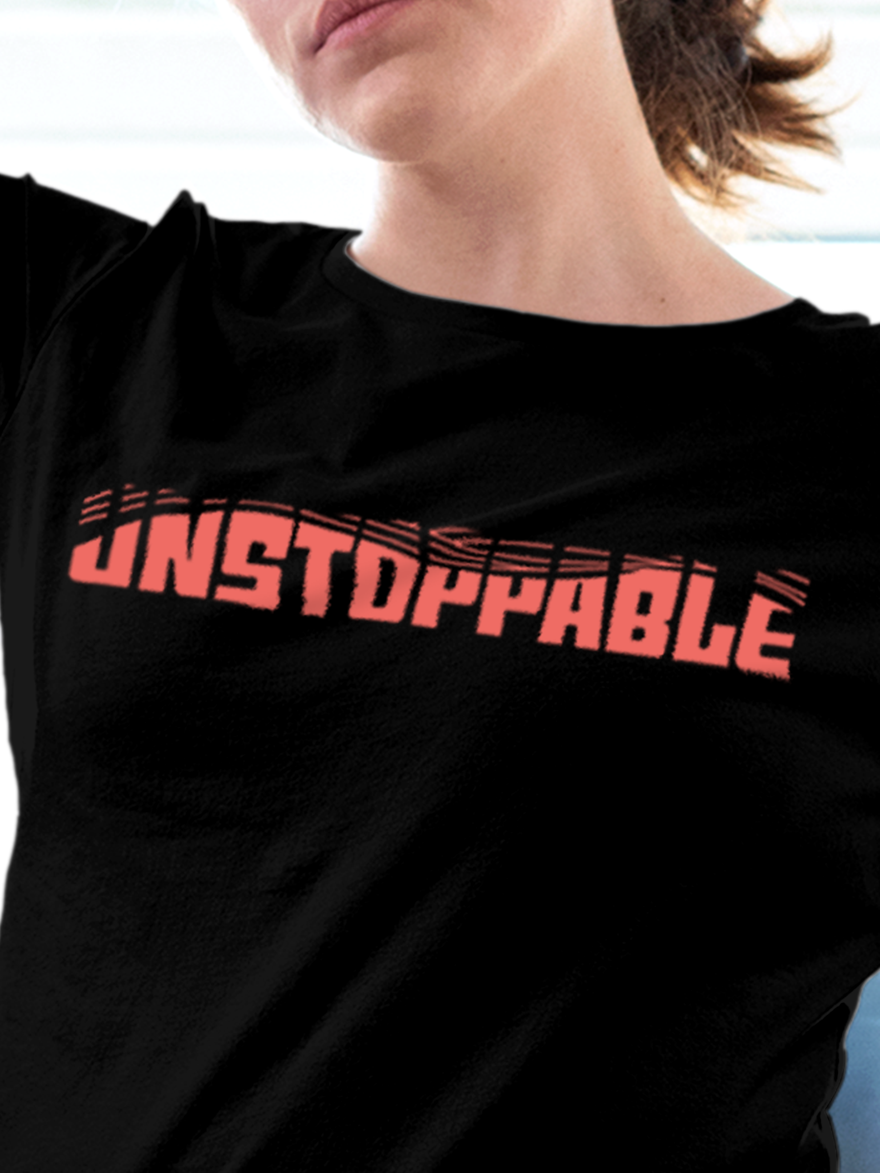 Close up of 'Unstoppable' design on Women's Black Round Neck T-shirt, highlighting intricate details and vibrant print.