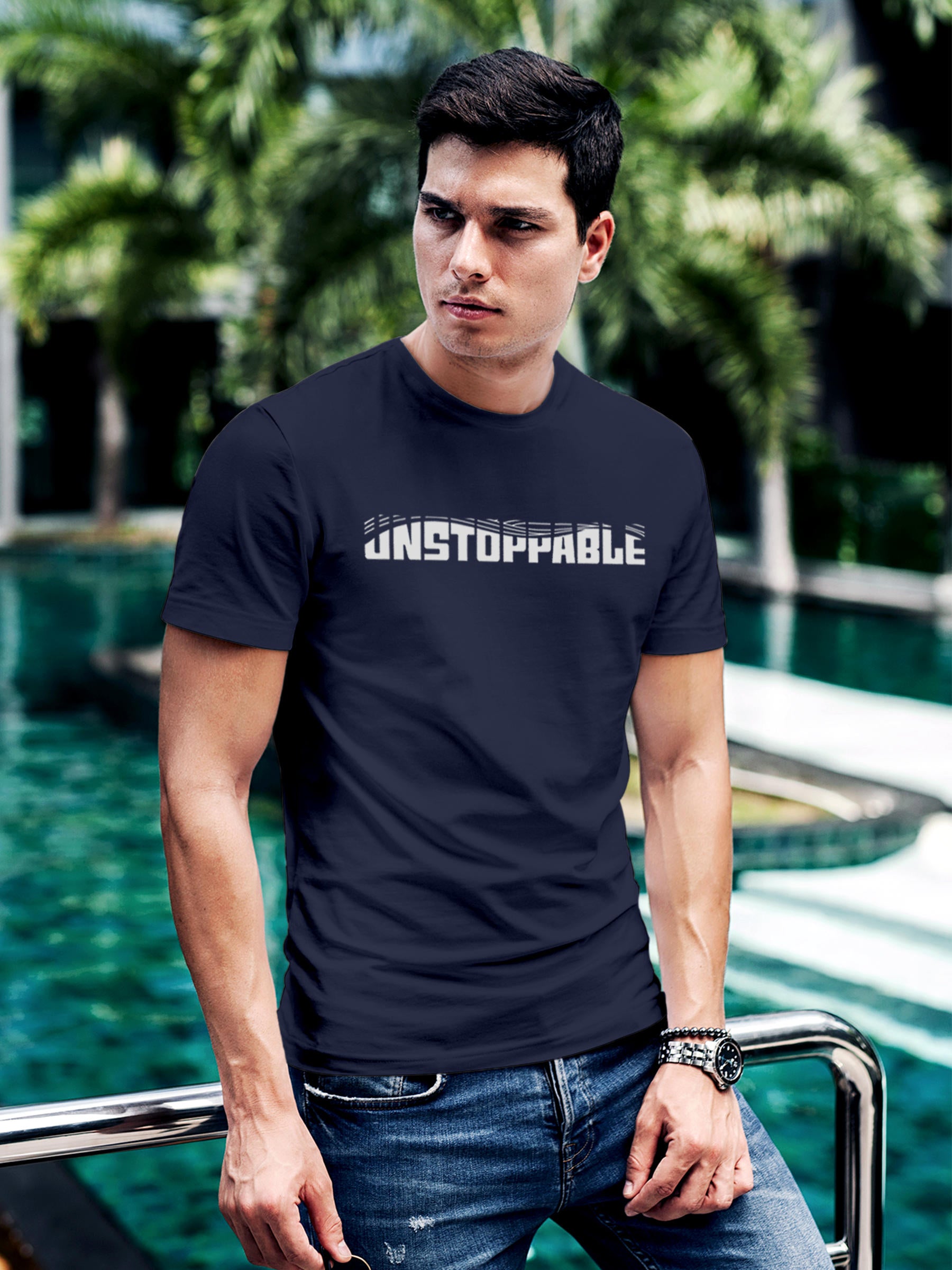Model wearing Men's Navy Blue Round Neck T-shirt with 'Unstoppable' design, offering effortless style and premium comfort