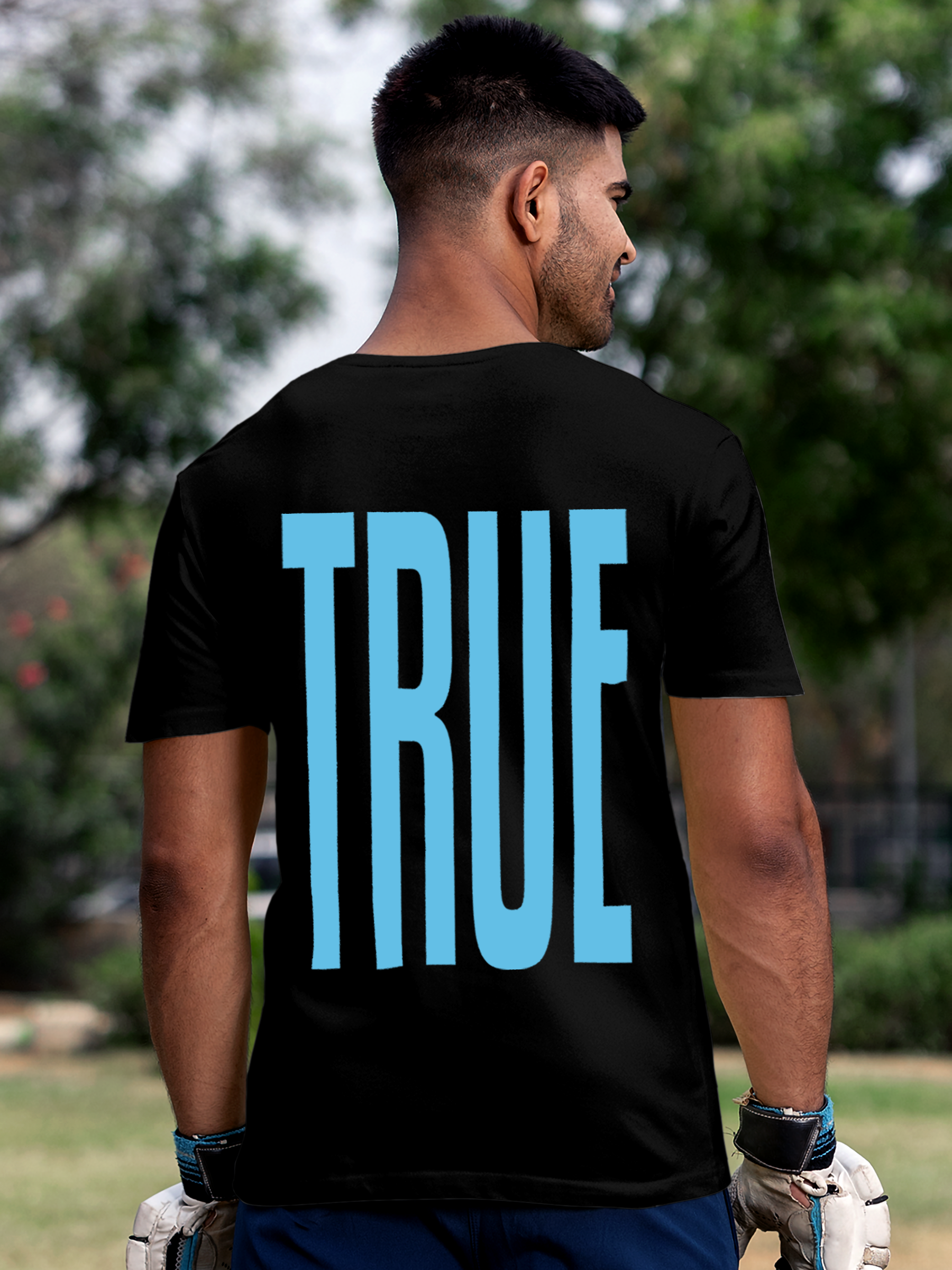 Model wearing Men's Black Round Neck T-shirt with 'Truth' design, offering effortless style and premium comfort