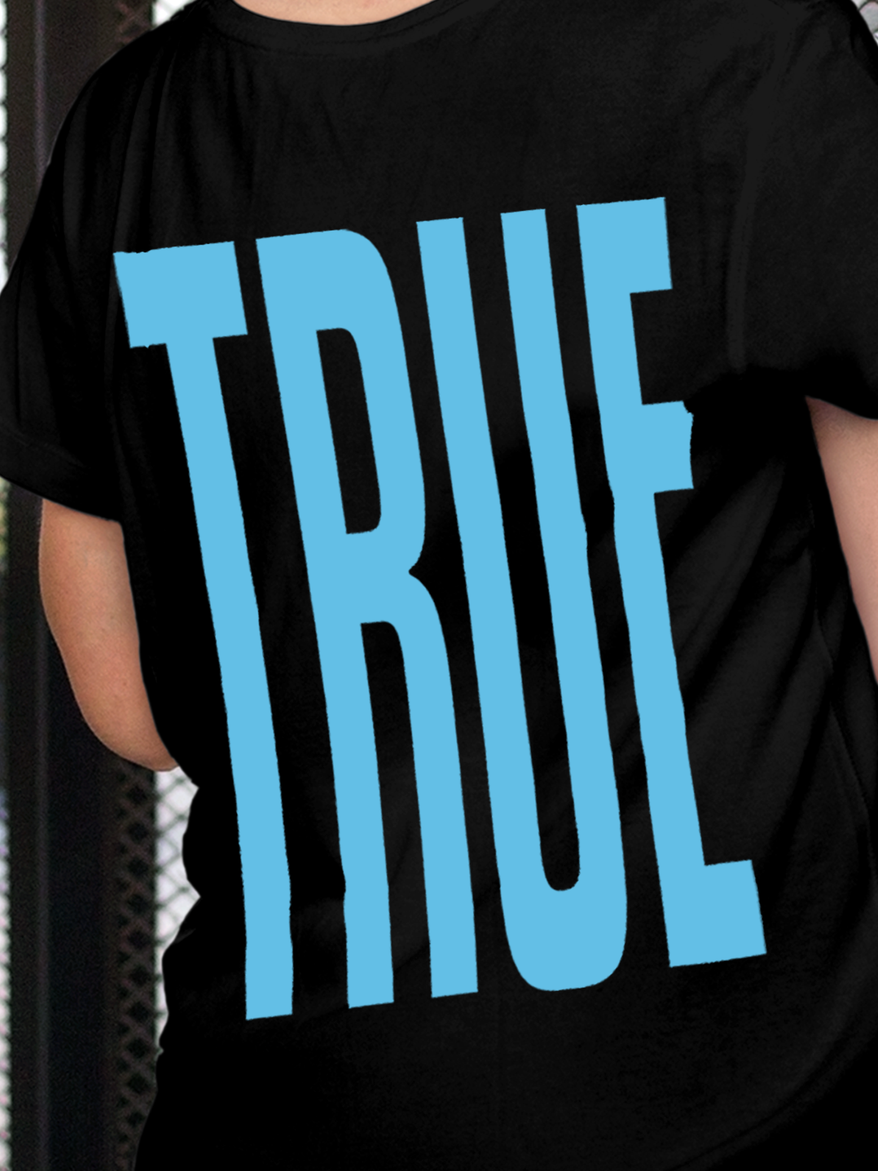 Close up of 'Truth' design on Women's Black Round Neck T-shirt, highlighting intricate details and vibrant print.
