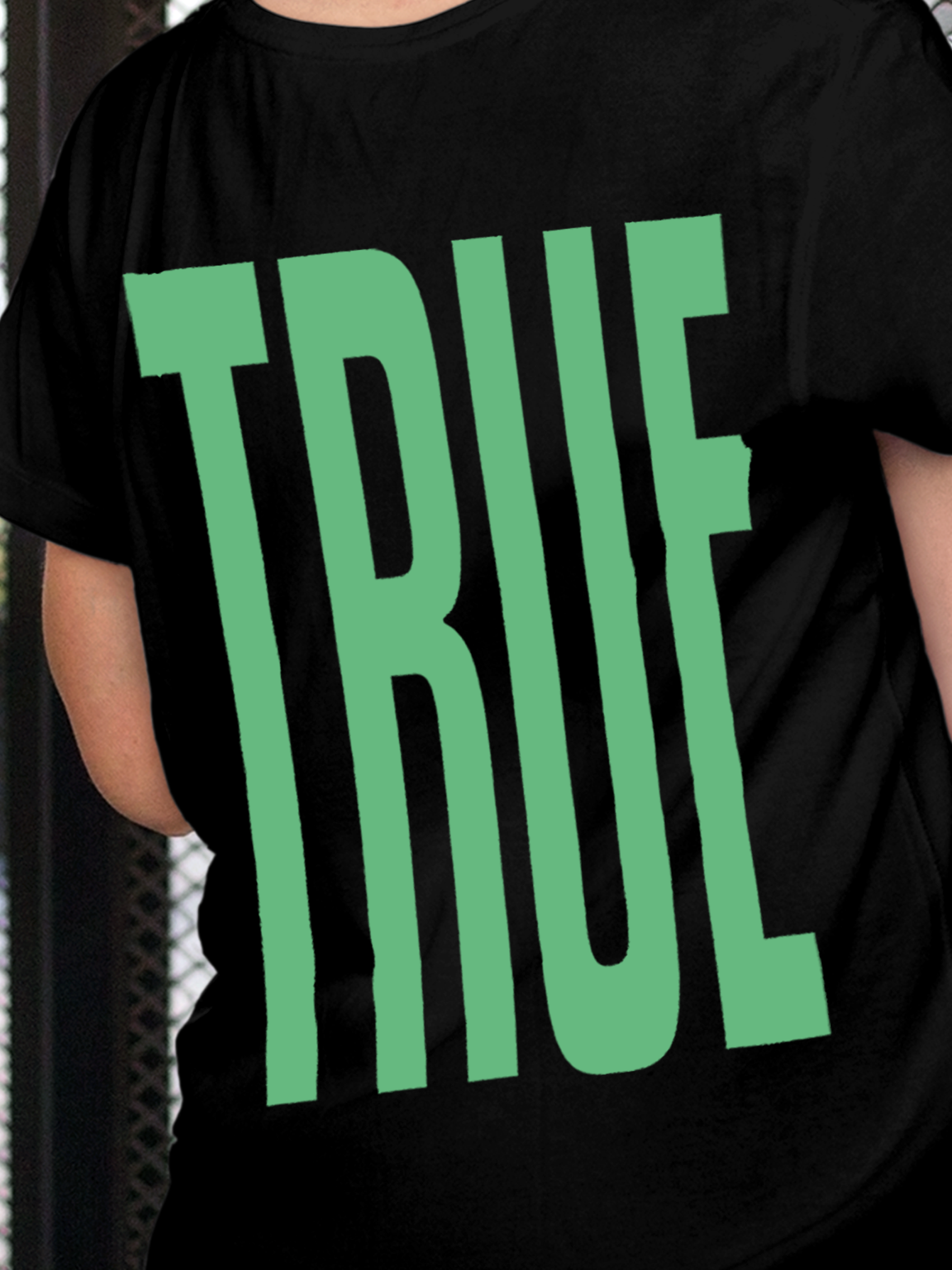 Close up of 'Truth' design on Women's Black Round Neck T-shirt, highlighting intricate details and vibrant print.