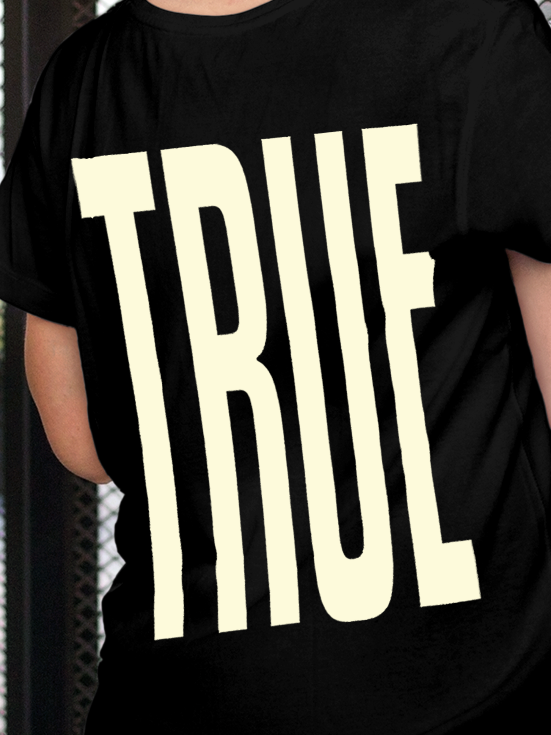 Close up of 'Truth' design on Women's Black Round Neck T-shirt, highlighting intricate details and vibrant print.