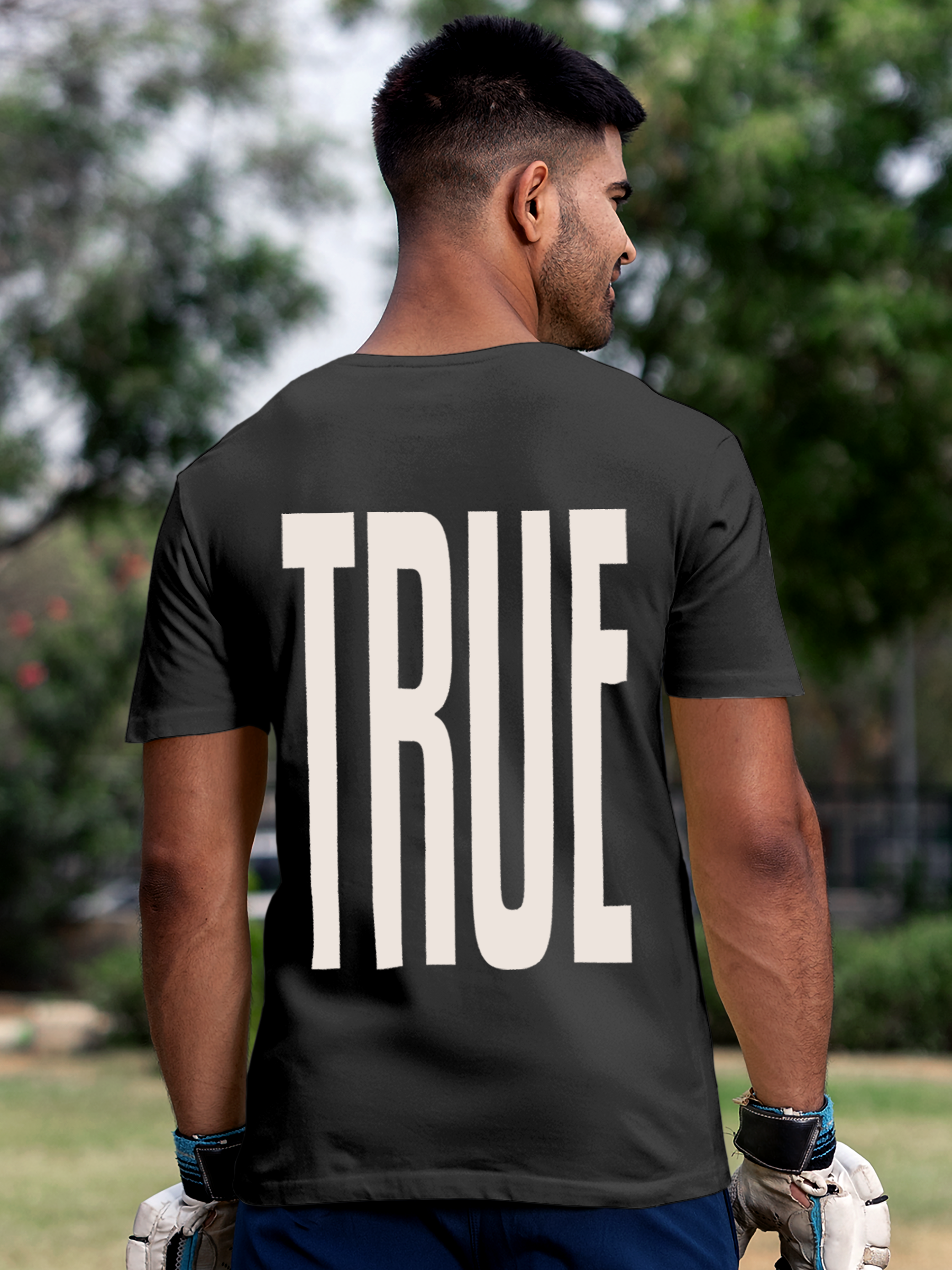 Model wearing Men's Dark Grey Round Neck T-shirt with 'Truth' design, offering effortless style and premium comfort