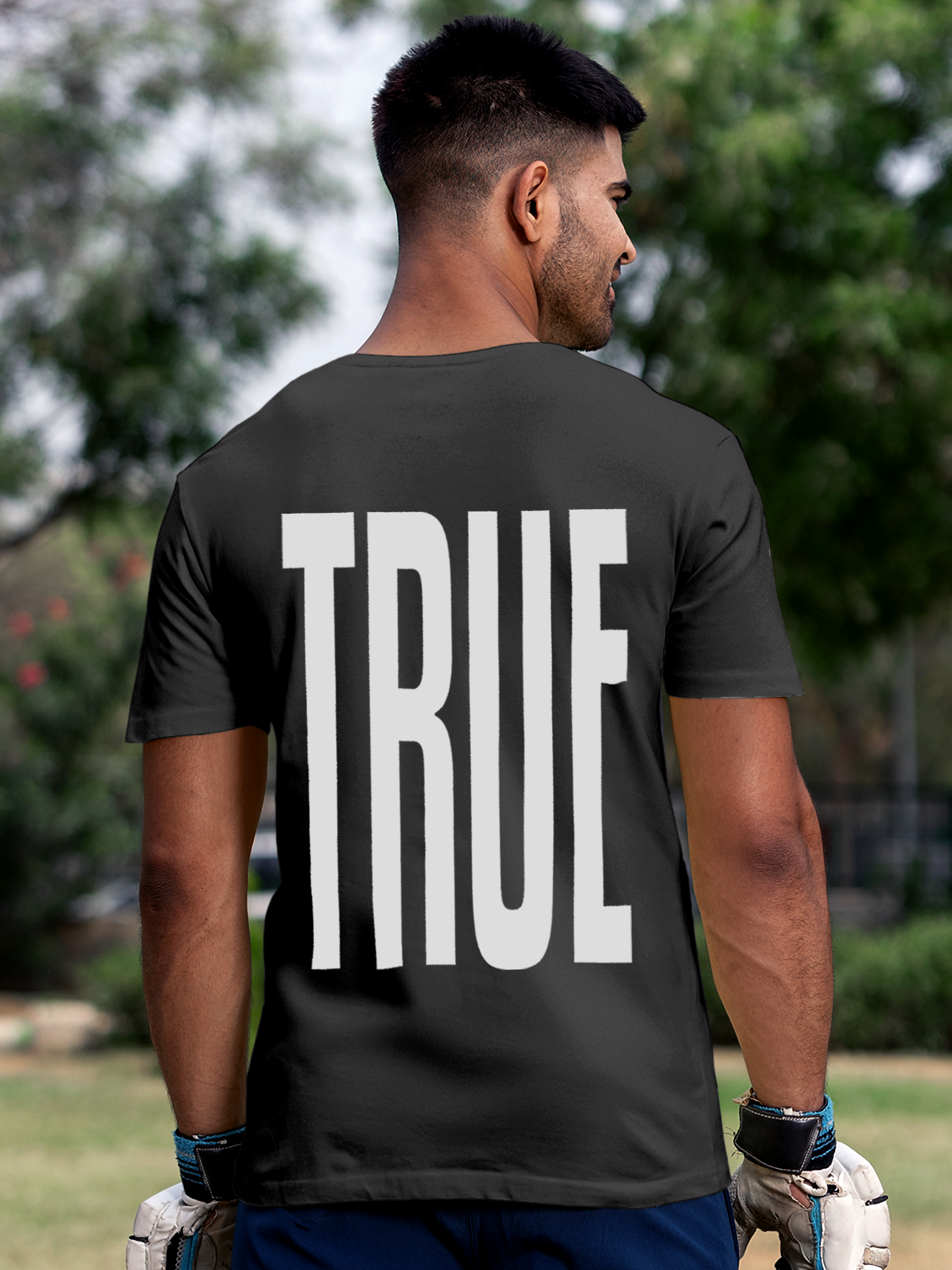 Model wearing Men's Dark Grey Round Neck T-shirt with 'Truth' design, offering effortless style and premium comfort