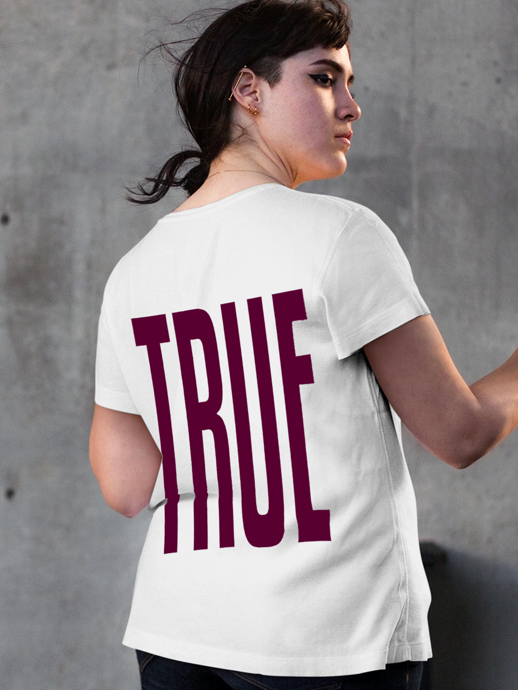 Model wearing Women's White Round Neck T-shirt with 'Truth' design, offering effortless style and premium comfort