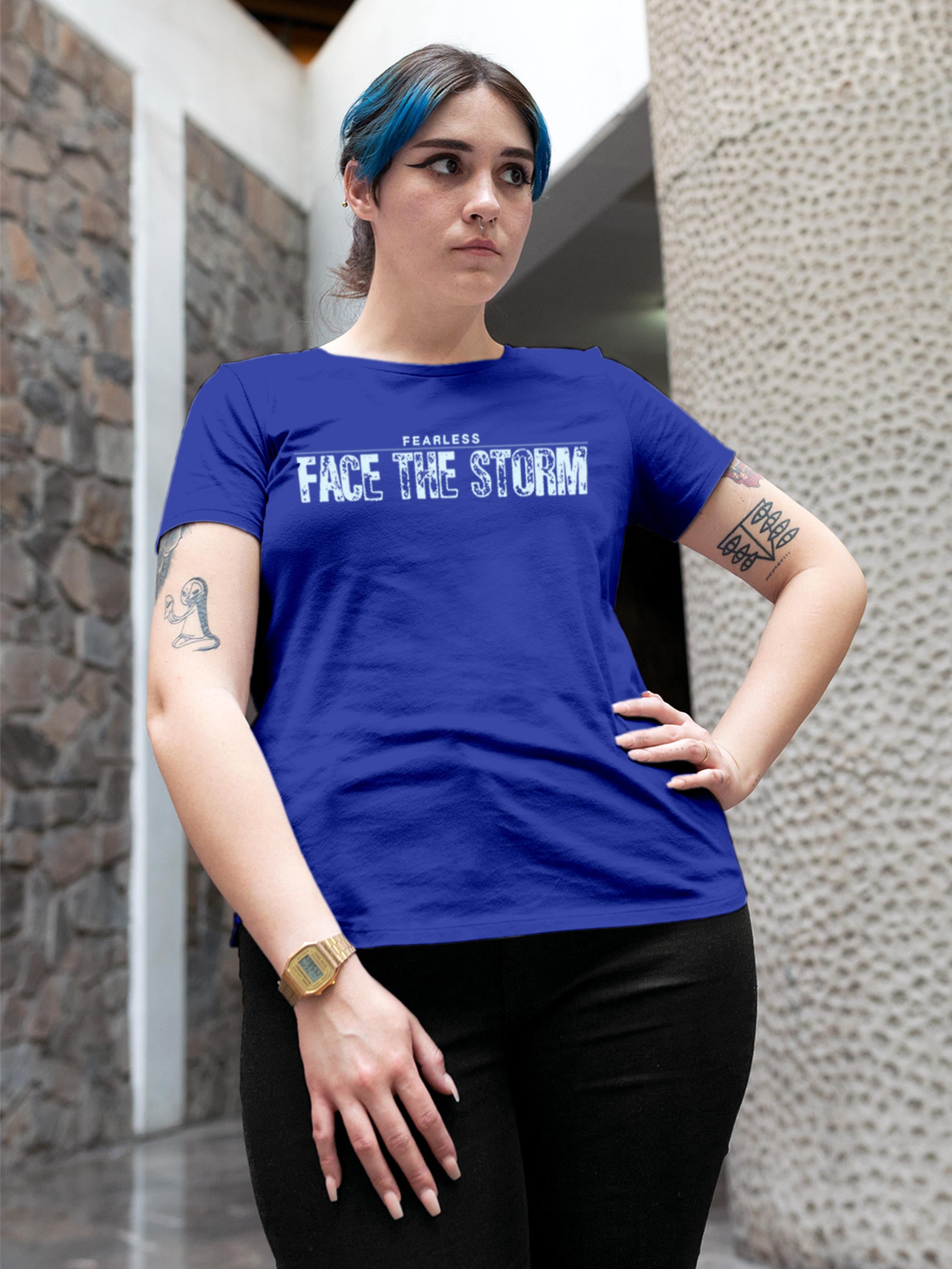 Model wearing Women's Blue Round Neck T-shirt with 'Fearless. Face the Storm' design, offering effortless style and premium comfort