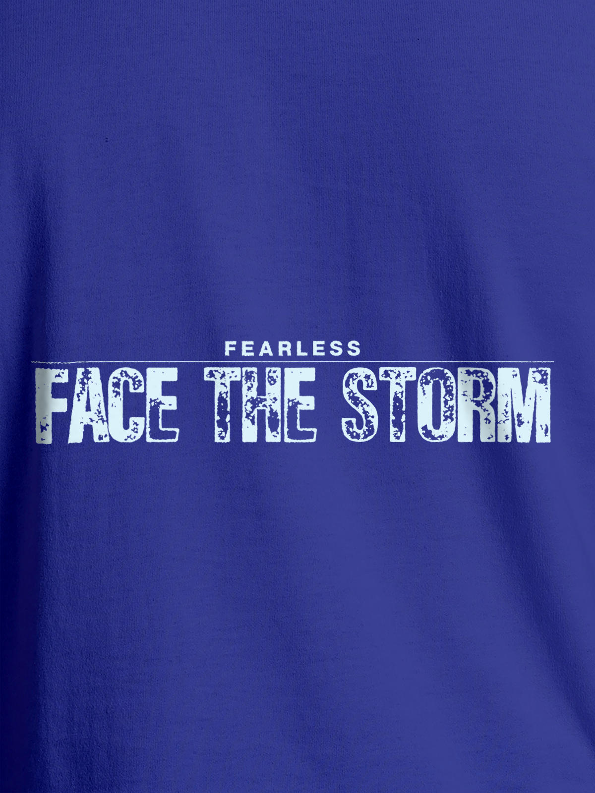 Close up of 'Fearless. Face the Storm' design on Women's Blue Round Neck T-shirt, highlighting intricate details and vibrant print.