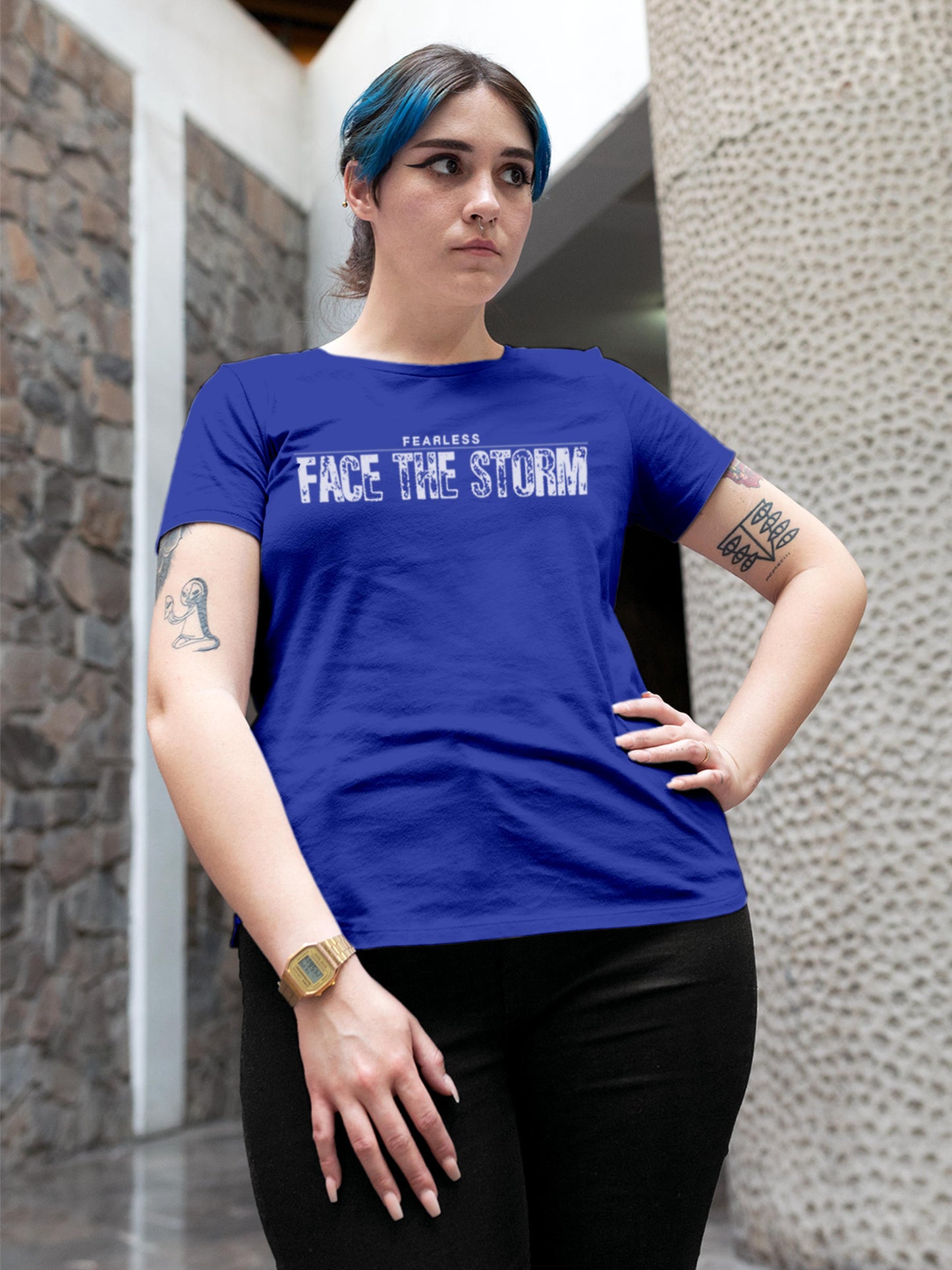Model wearing Women's Blue Round Neck T-shirt with 'Fearless. Face the Storm' design, offering effortless style and premium comfort