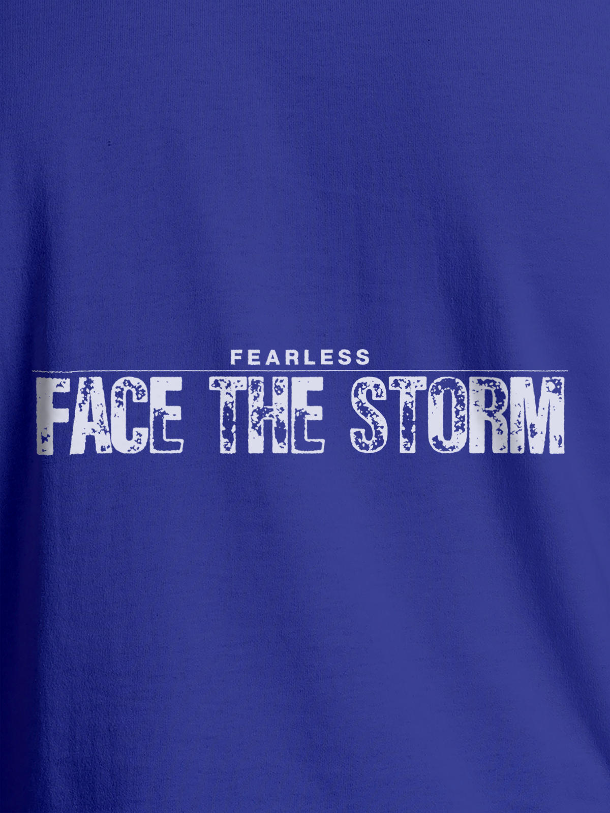 Close up of 'Fearless. Face the Storm' design on Women's Blue Round Neck T-shirt, highlighting intricate details and vibrant print.
