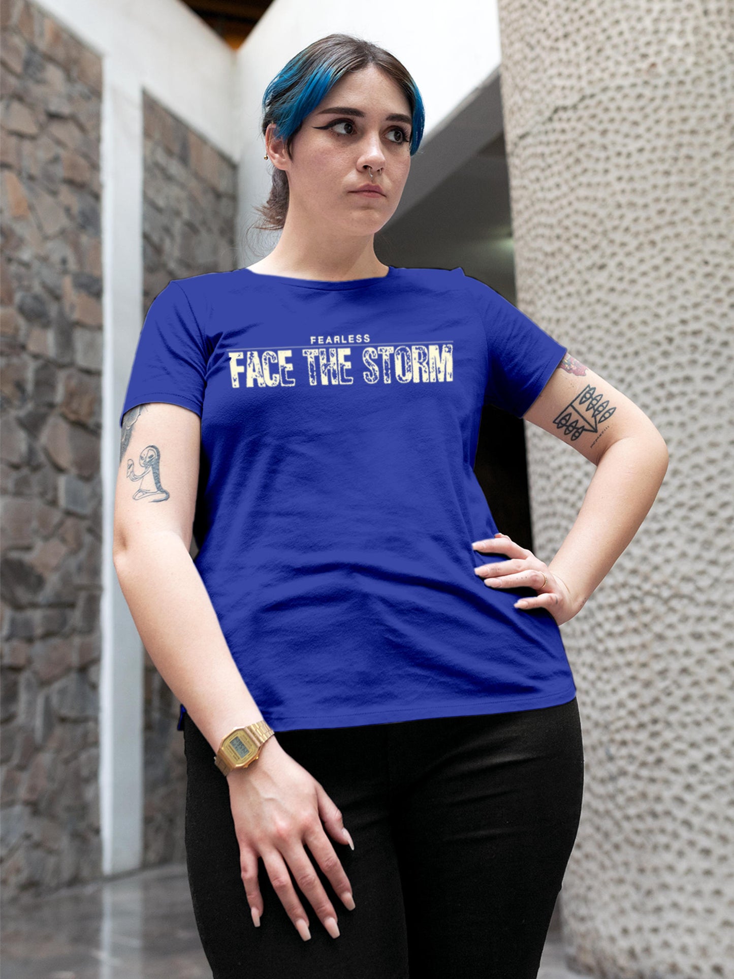Model wearing Women's Blue Round Neck T-shirt with 'Fearless. Face the Storm' design, offering effortless style and premium comfort