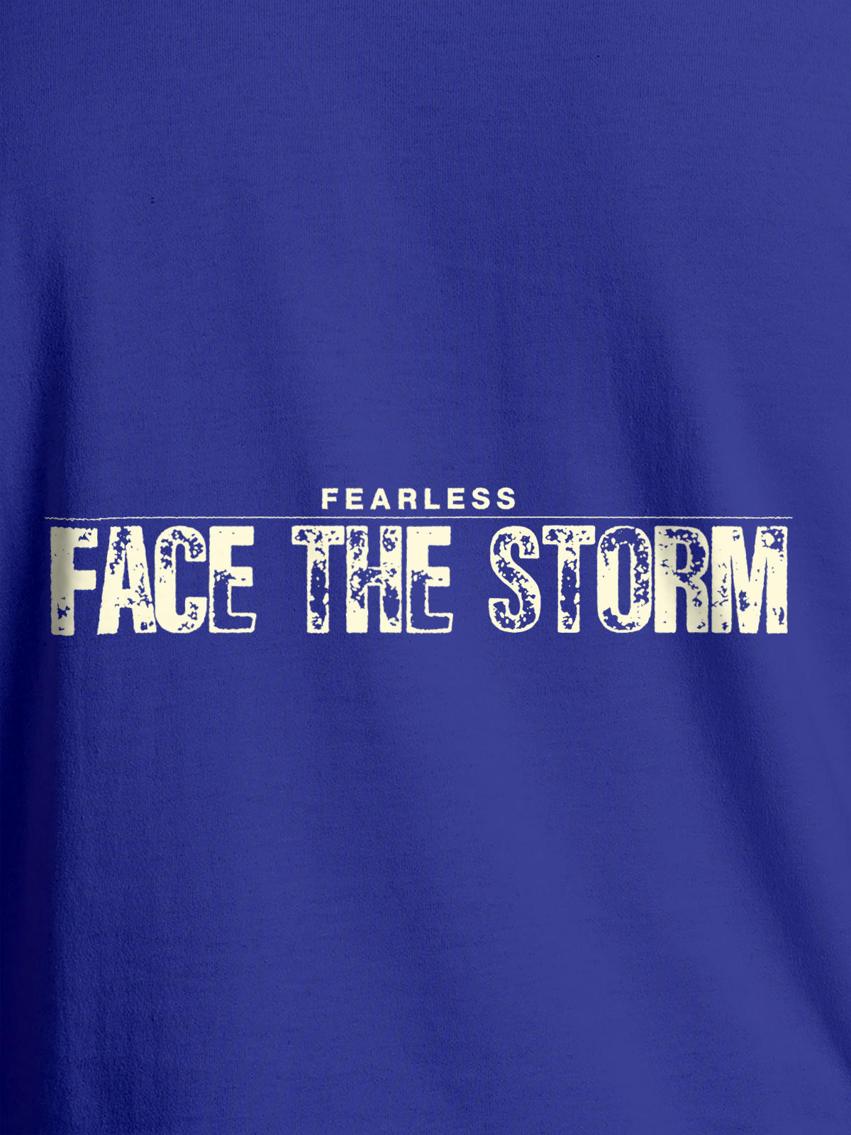 Close up of 'Fearless. Face the Storm' design on Women's Blue Round Neck T-shirt, highlighting intricate details and vibrant print.