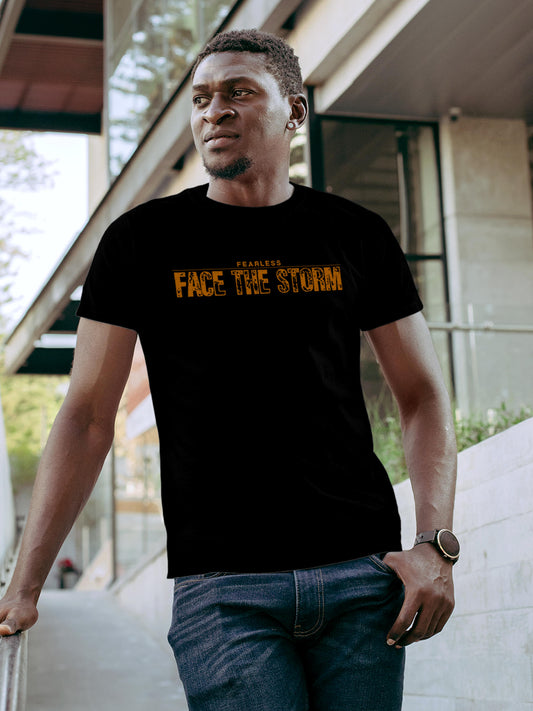 Model wearing Men's Black Round Neck T-shirt with 'Fearless. Face the Storm' design, offering effortless style and premium comfort