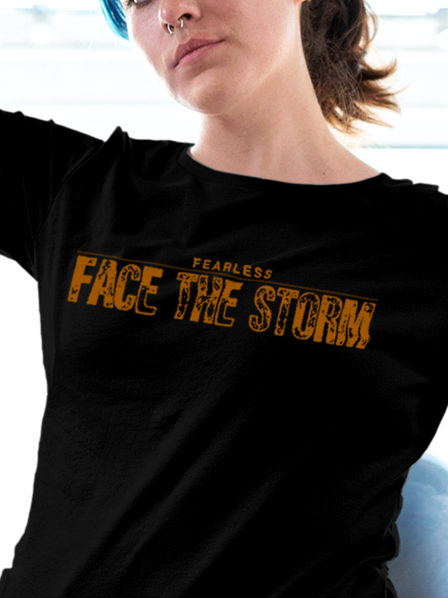 Close up of 'Fearless. Face the Storm' design on Women's Black Round Neck T-shirt, highlighting intricate details and vibrant print.