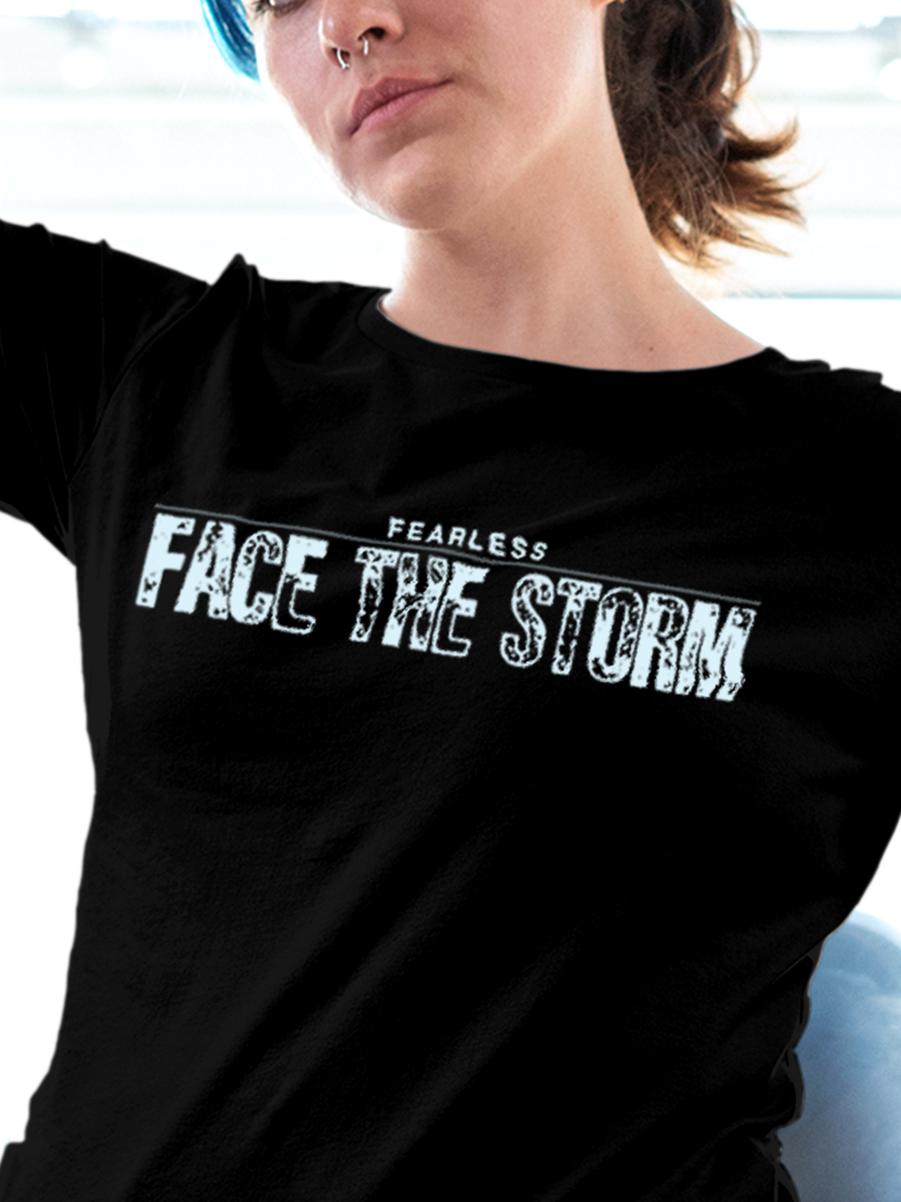 Close up of 'Fearless. Face the Storm' design on Women's Black Round Neck T-shirt, highlighting intricate details and vibrant print.