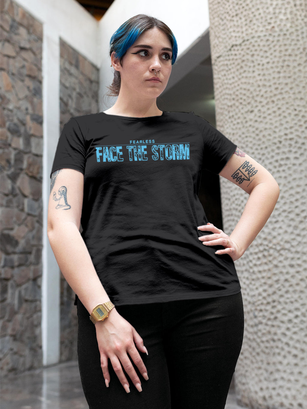 Model wearing Women's Dark Grey Round Neck T-shirt with 'Fearless. Face the Storm' design, offering effortless style and premium comfort