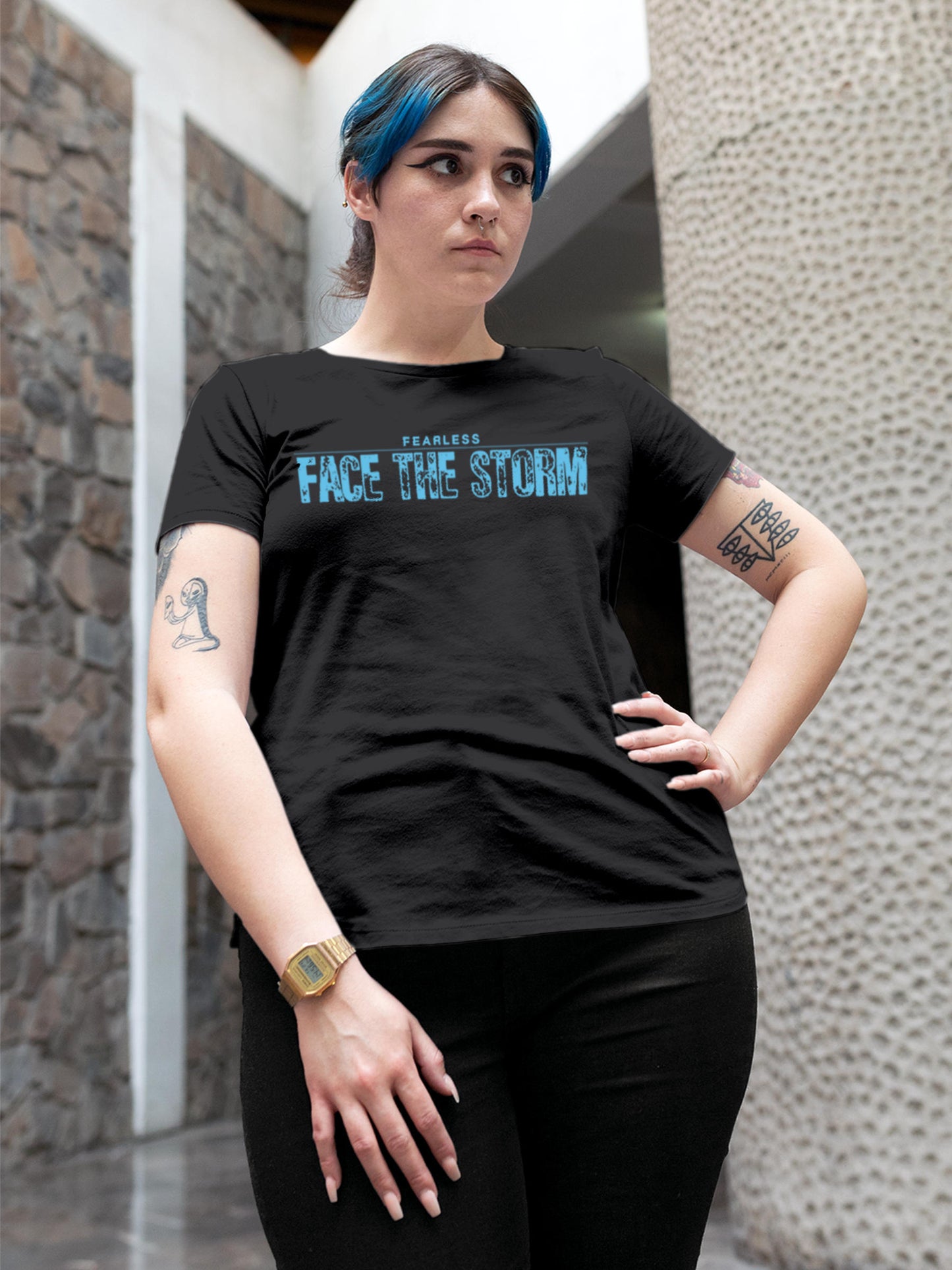 Model wearing Women's Dark Grey Round Neck T-shirt with 'Fearless. Face the Storm' design, offering effortless style and premium comfort