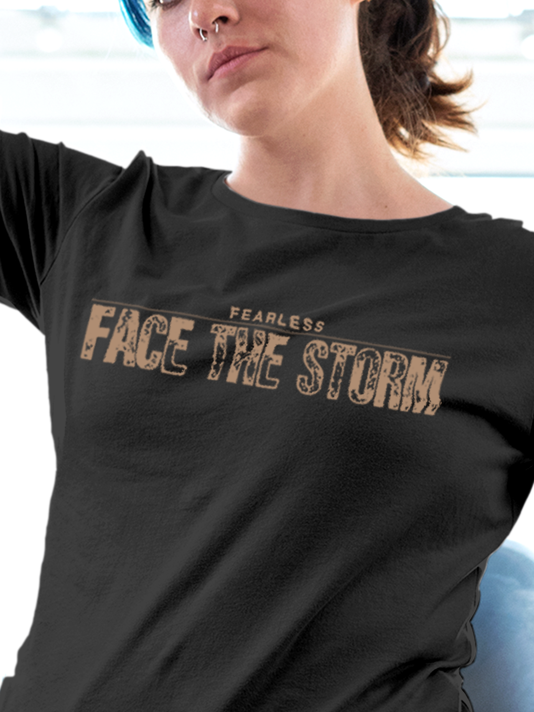 Close up of 'Fearless. Face the Storm' design on Women's Dark Grey Round Neck T-shirt, highlighting intricate details and vibrant print.