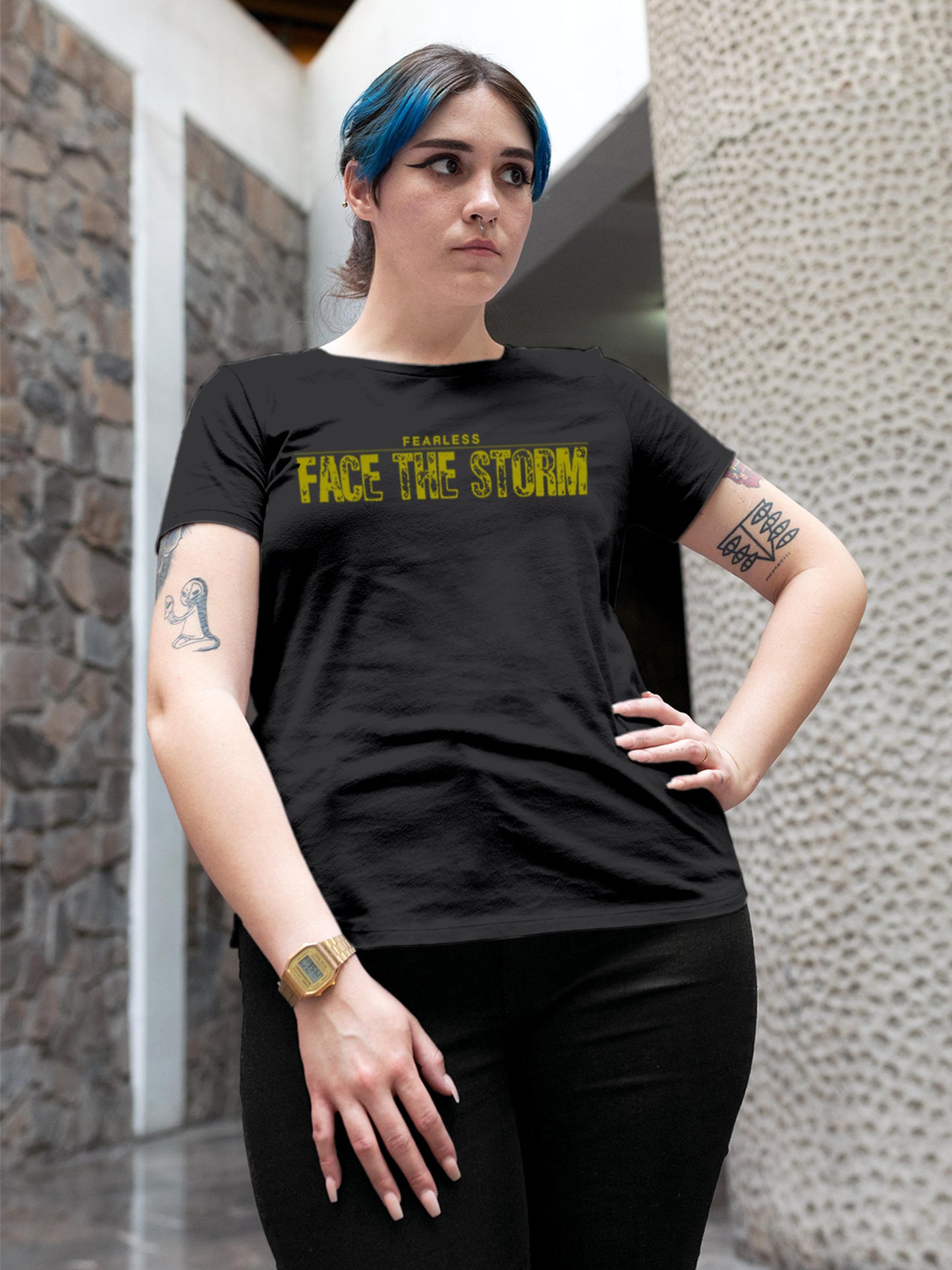 Model wearing Women's Dark Grey Round Neck T-shirt with 'Fearless. Face the Storm' design, offering effortless style and premium comfort