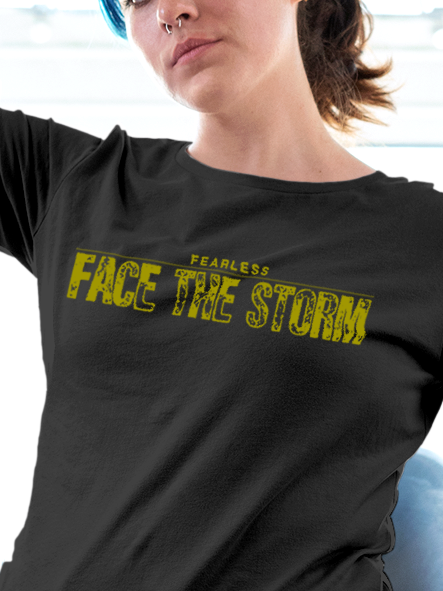 Close up of 'Fearless. Face the Storm' design on Women's Dark Grey Round Neck T-shirt, highlighting intricate details and vibrant print.