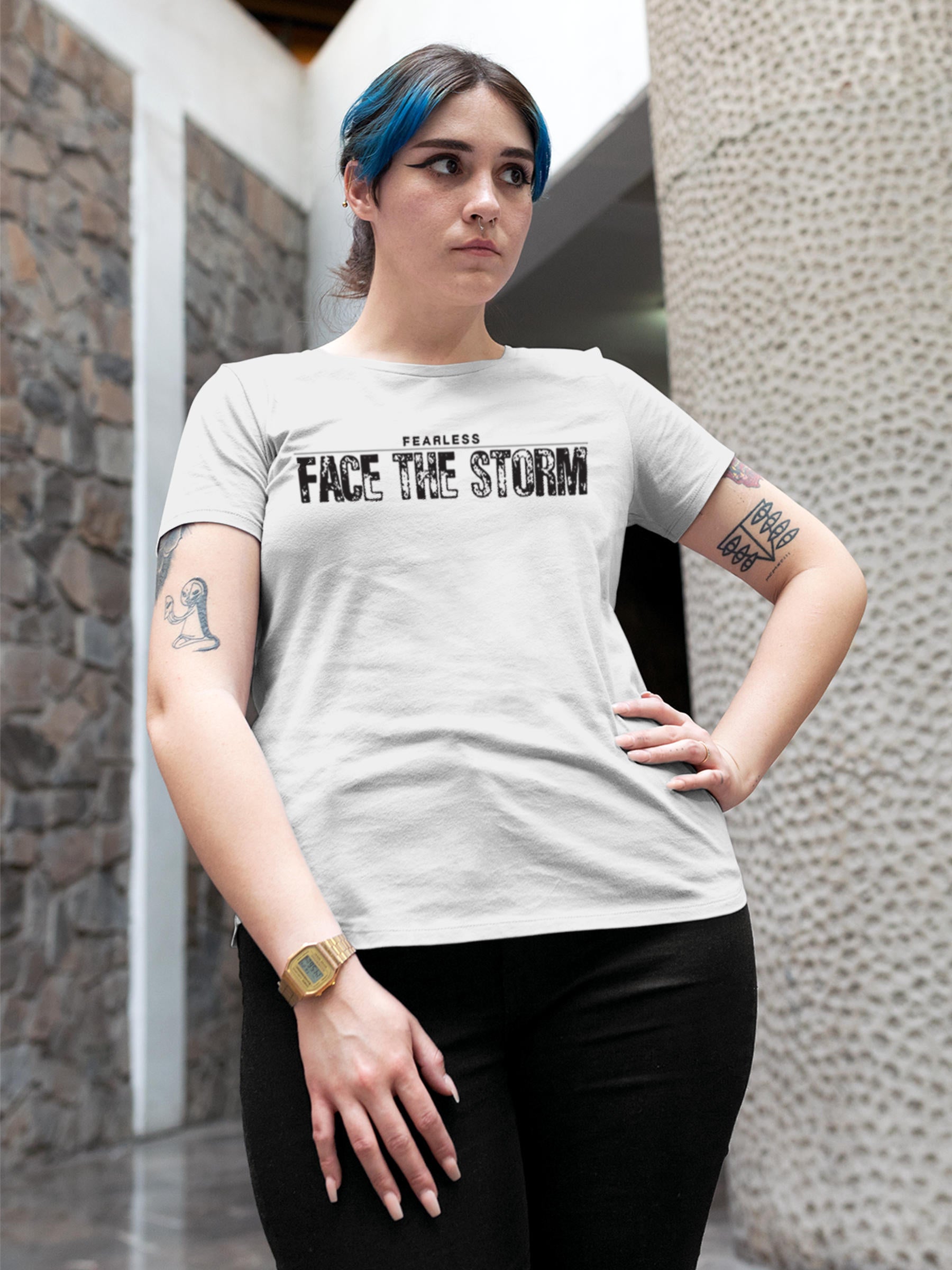 Model wearing Women's White Round Neck T-shirt with 'Fearless. Face the Storm' design, offering effortless style and premium comfort