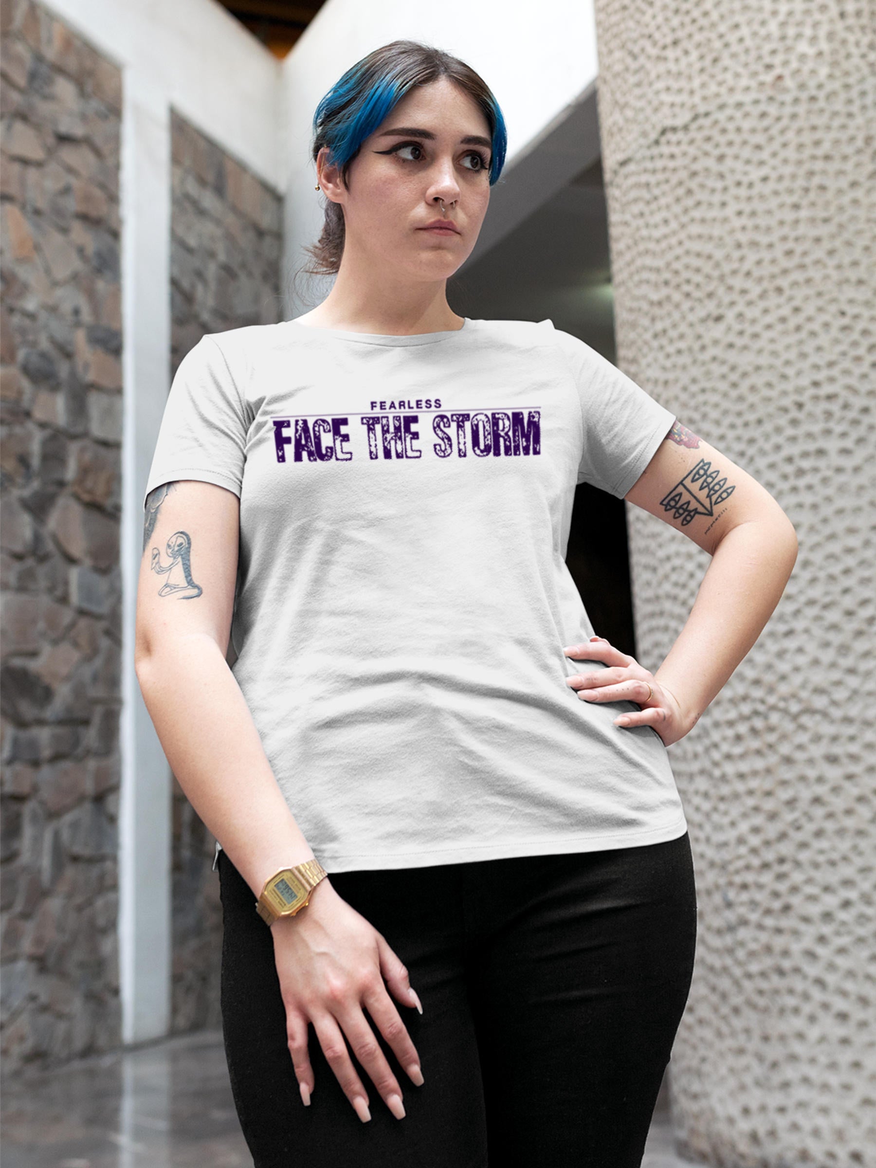 Model wearing Women's White Round Neck T-shirt with 'Fearless. Face the Storm' design, offering effortless style and premium comfort