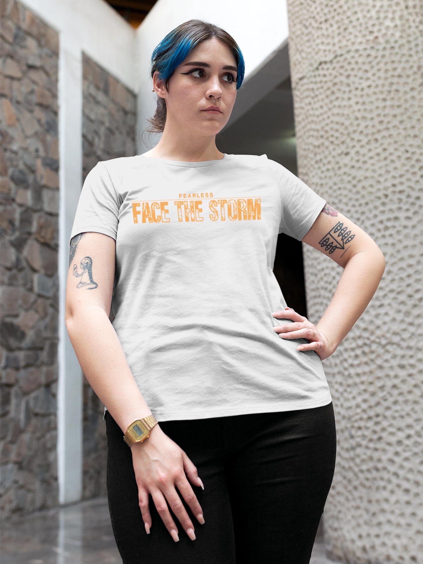 Model wearing Women's White Round Neck T-shirt with 'Fearless. Face the Storm' design, offering effortless style and premium comfort