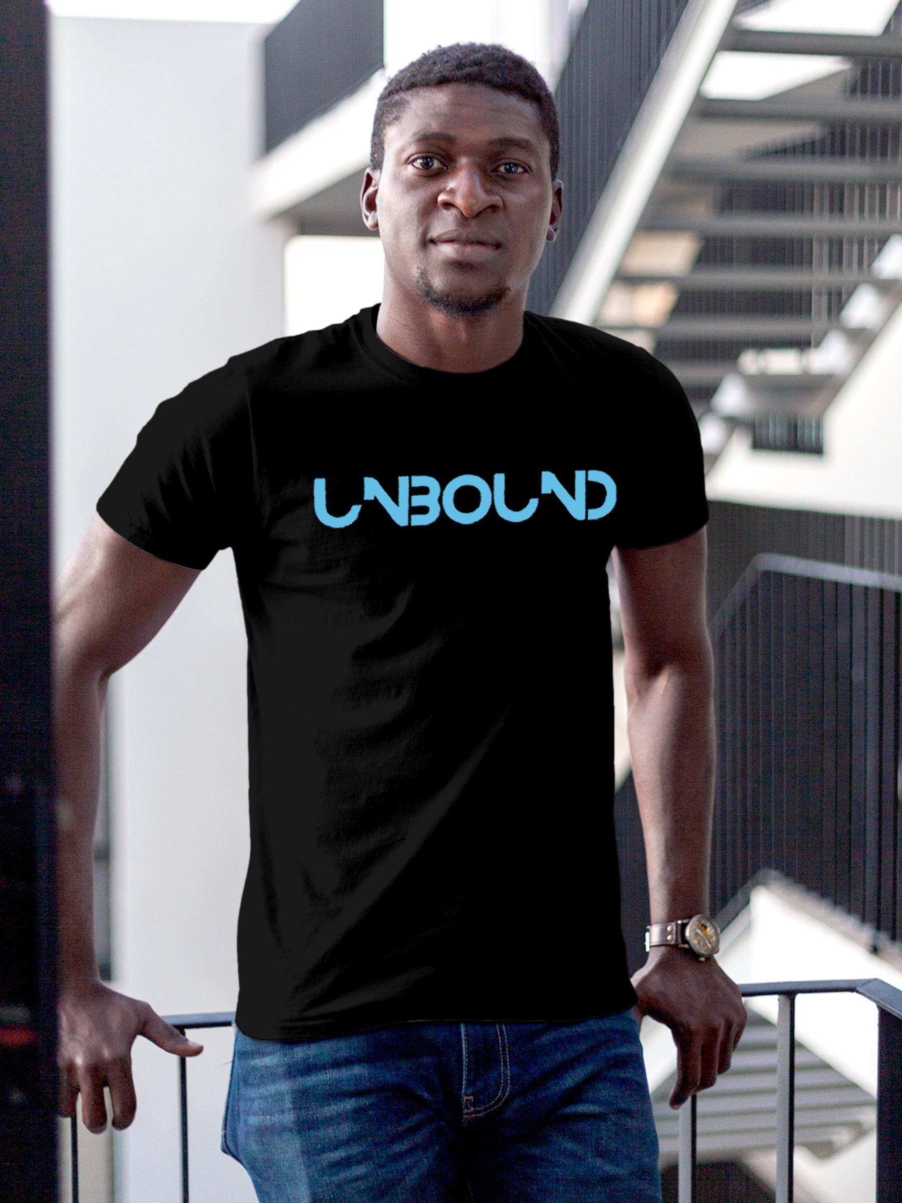 Model wearing Men's Black Round Neck T-shirt with 'Unbound' design, offering effortless style and premium comfort